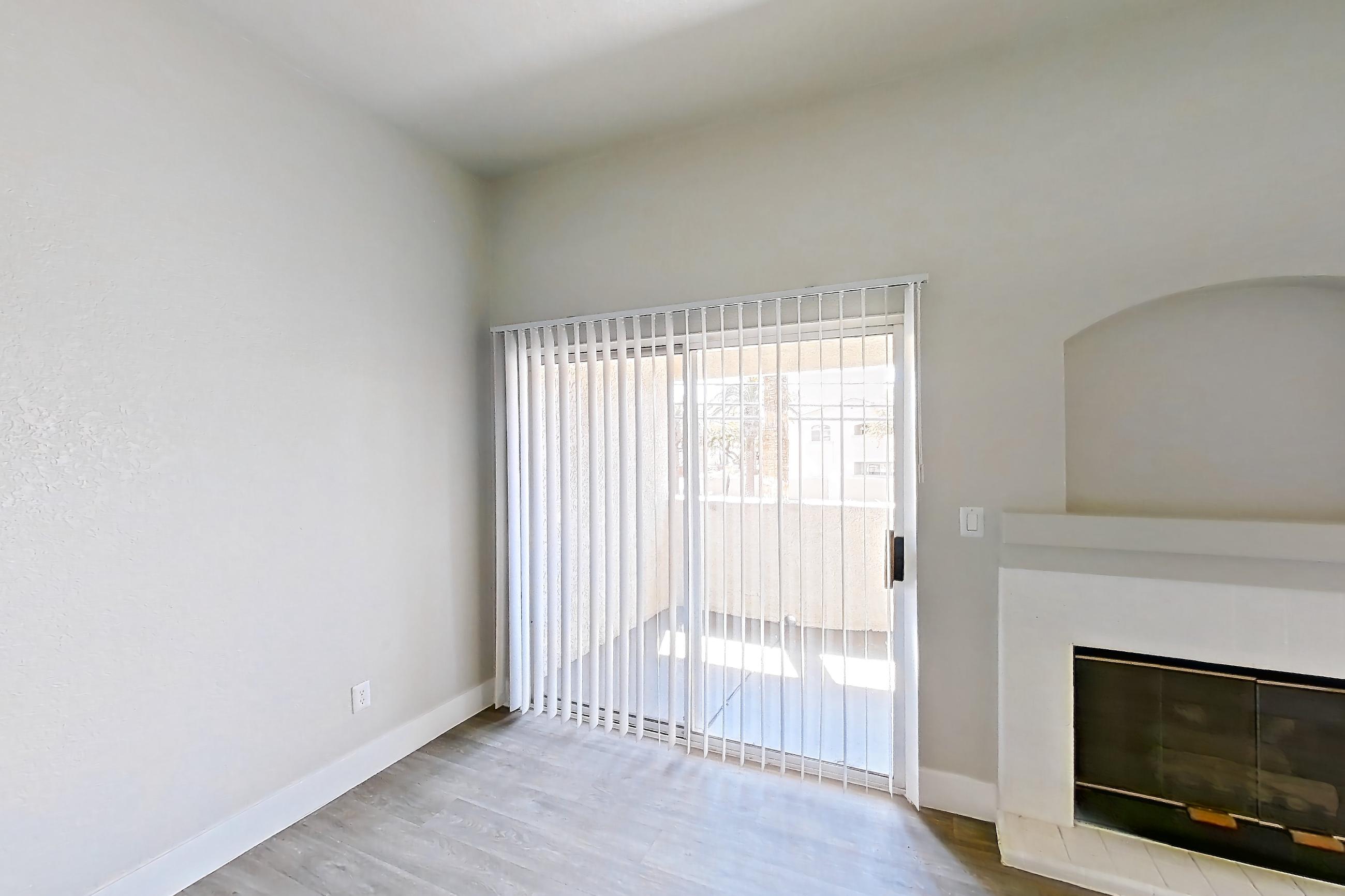 Living room with fireplace and light wood-finish flooring, Apartment 2146 at Vintage Pointe