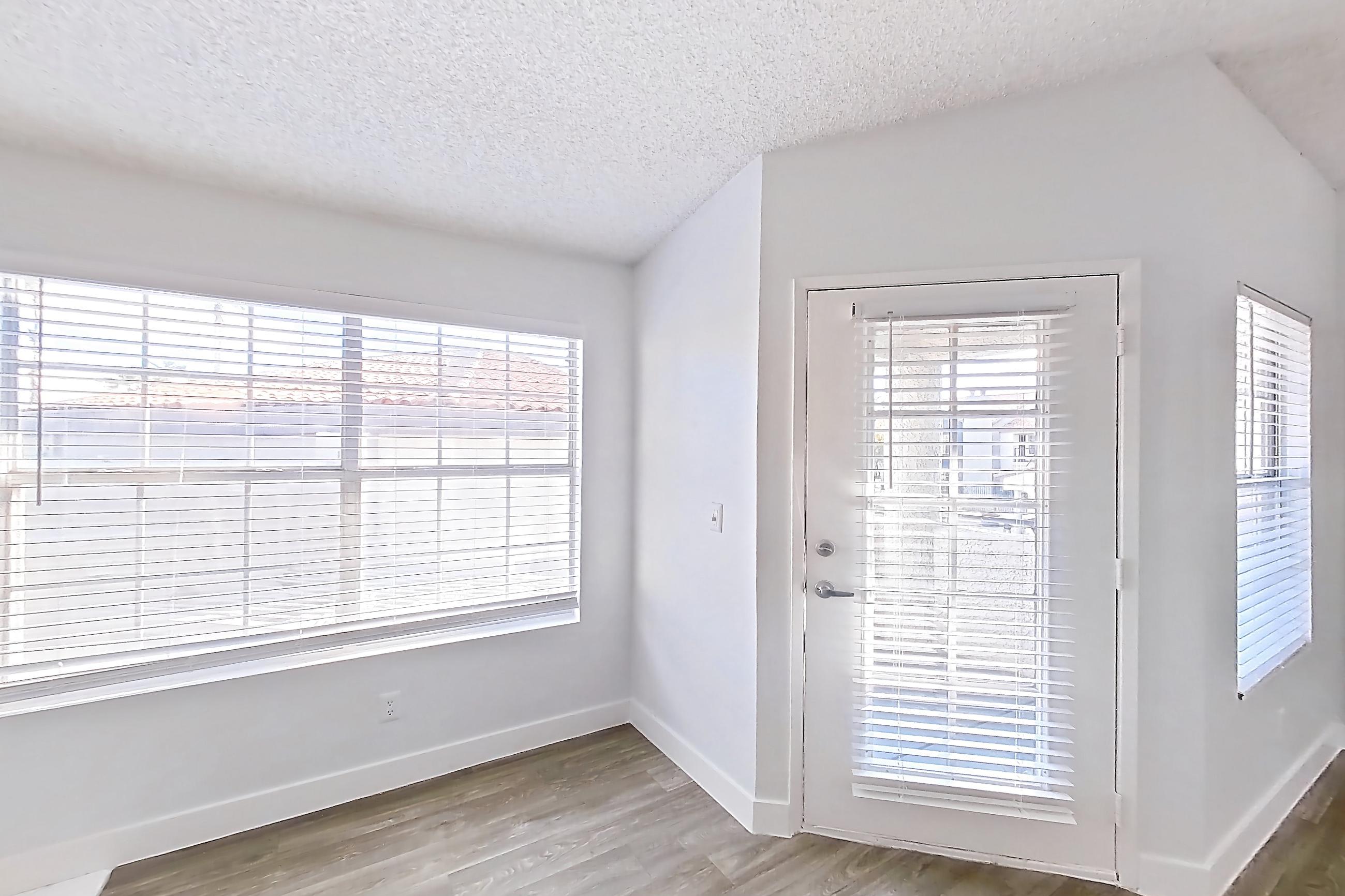 Living room with dark wood-finish flooring, fireplace, light wood-finish flooring, and tile fireplace, Apartment 2091 at The Met Las Vegas