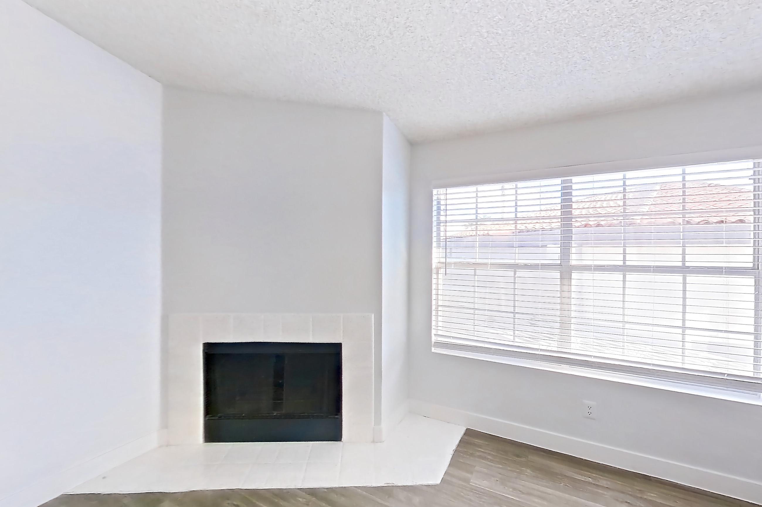 Living room with dark wood-finish flooring, fireplace, light wood-finish flooring, and tile fireplace, Apartment 2091 at The Met Las Vegas