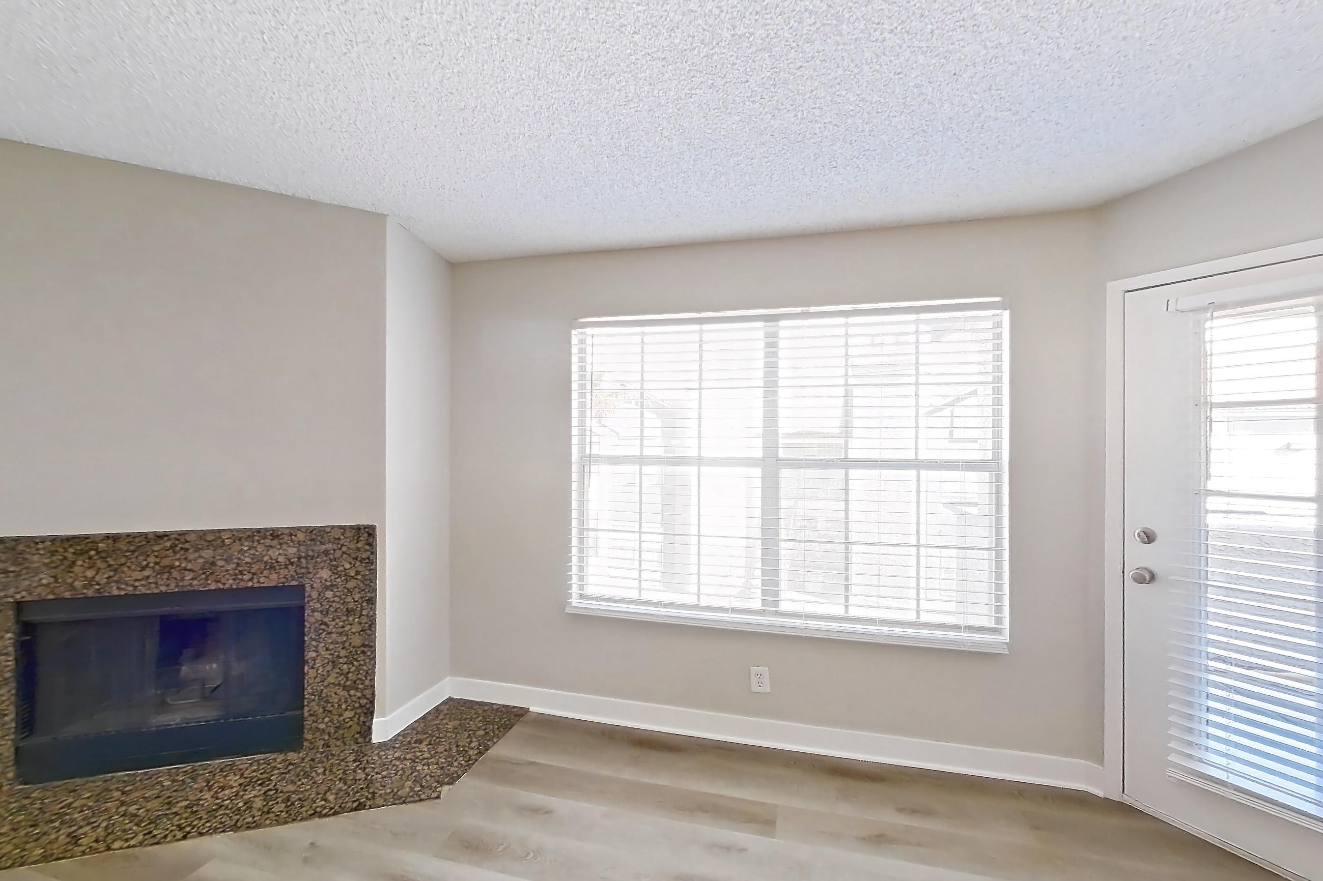 Living room with fireplace, light wood-finish flooring, and marble fireplace, Apartment 2171 at The Met Las Vegas
