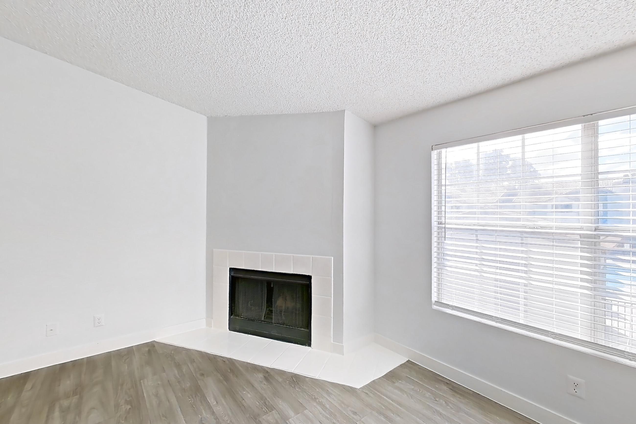 Living room with dark wood-finish flooring, fireplace, light wood-finish flooring, and tile fireplace, Apartment 2175 at The Met Las Vegas