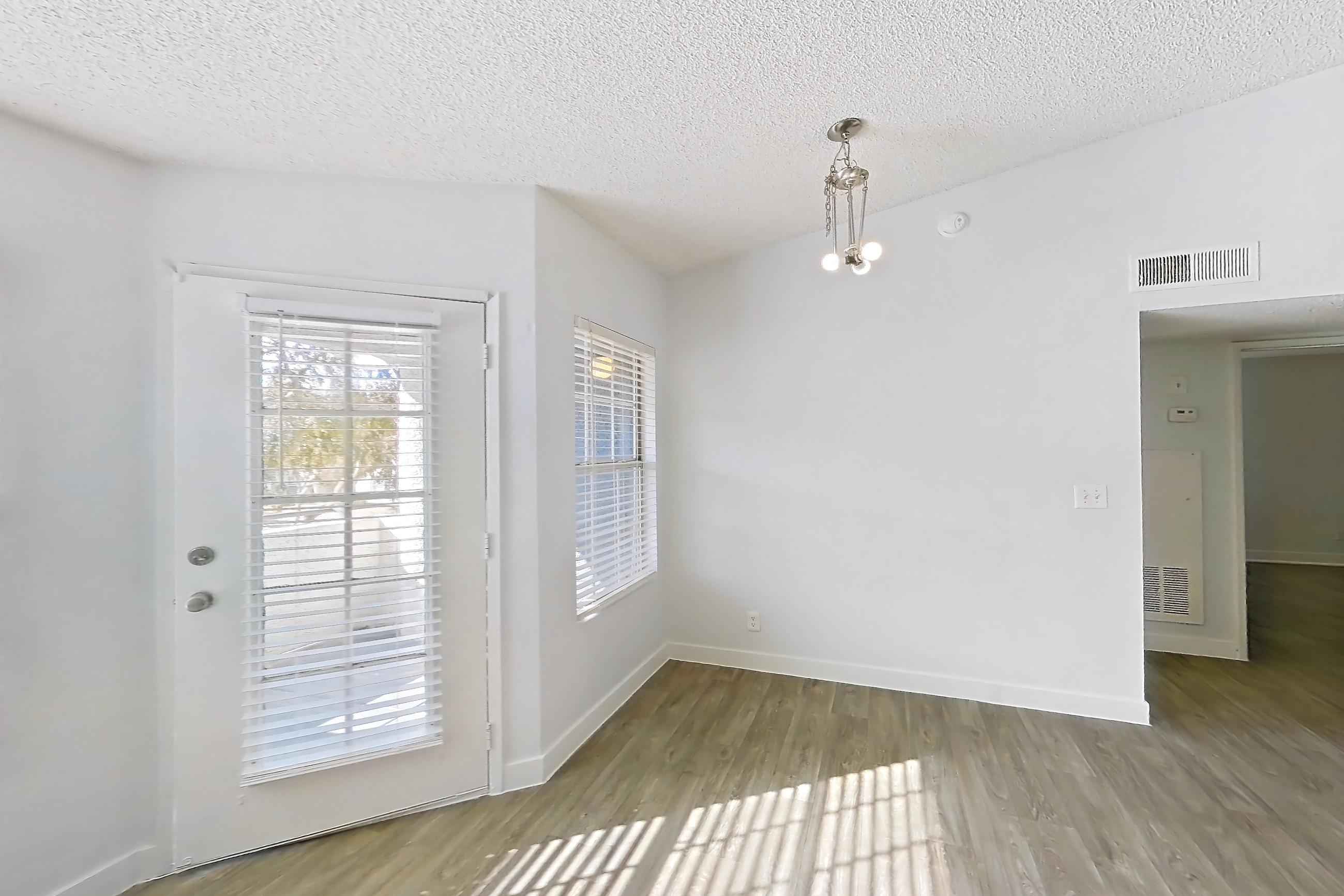 Living room with dark wood-finish flooring, fireplace, light wood-finish flooring, and tile fireplace, Apartment 2175 at The Met Las Vegas