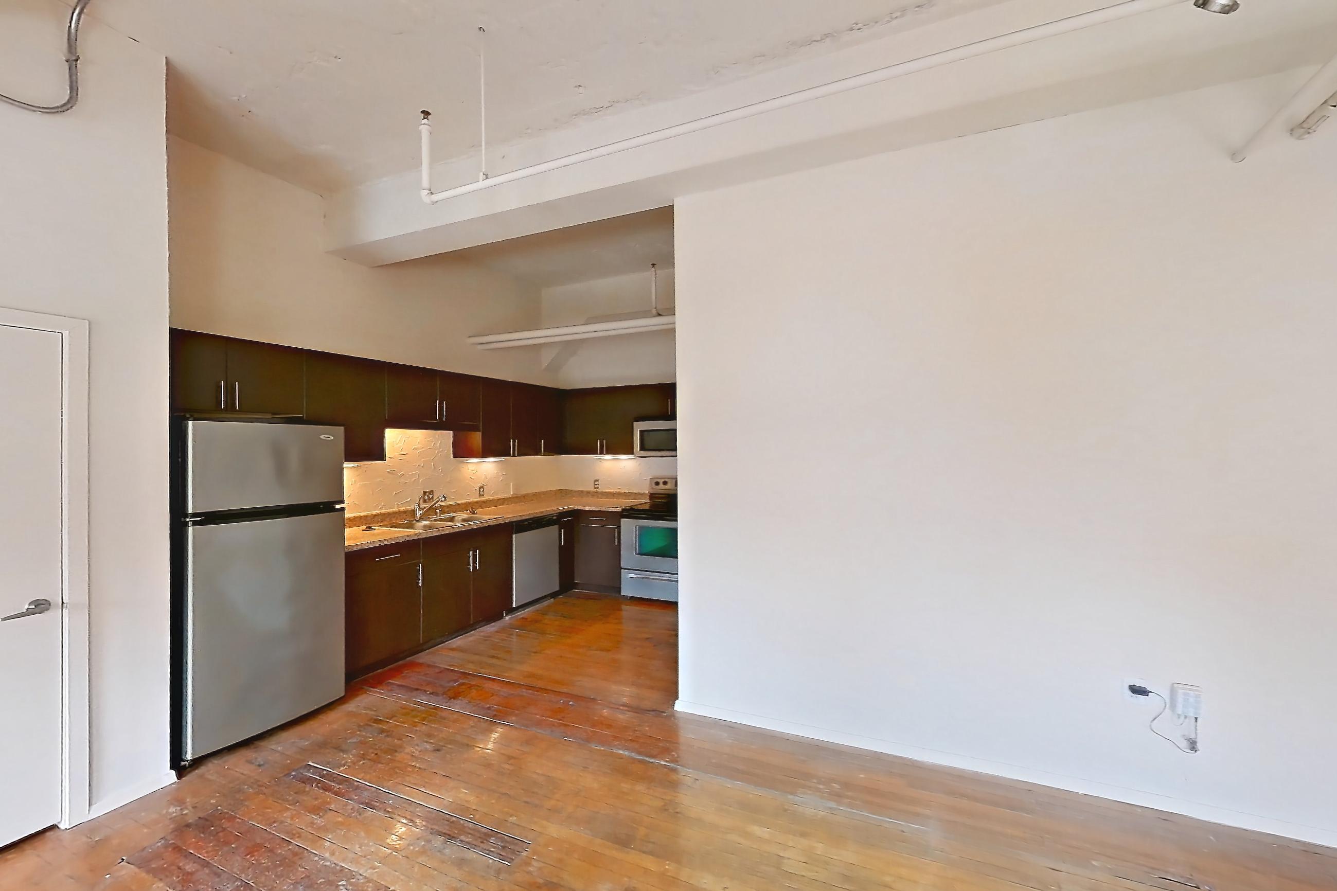 Living room in a 1U floor plan apartment, representative of Apartment W-0902 at The Wilson