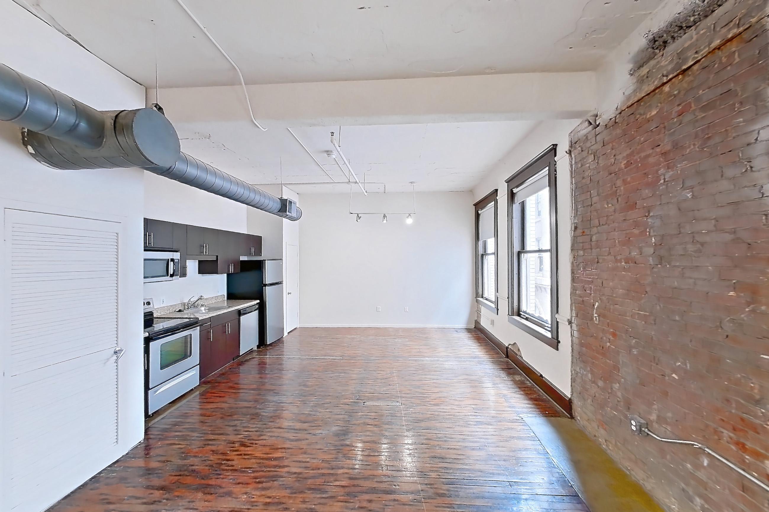Living space in a 0D floor plan apartment, representative of Apartment W-0418 at The Wilson