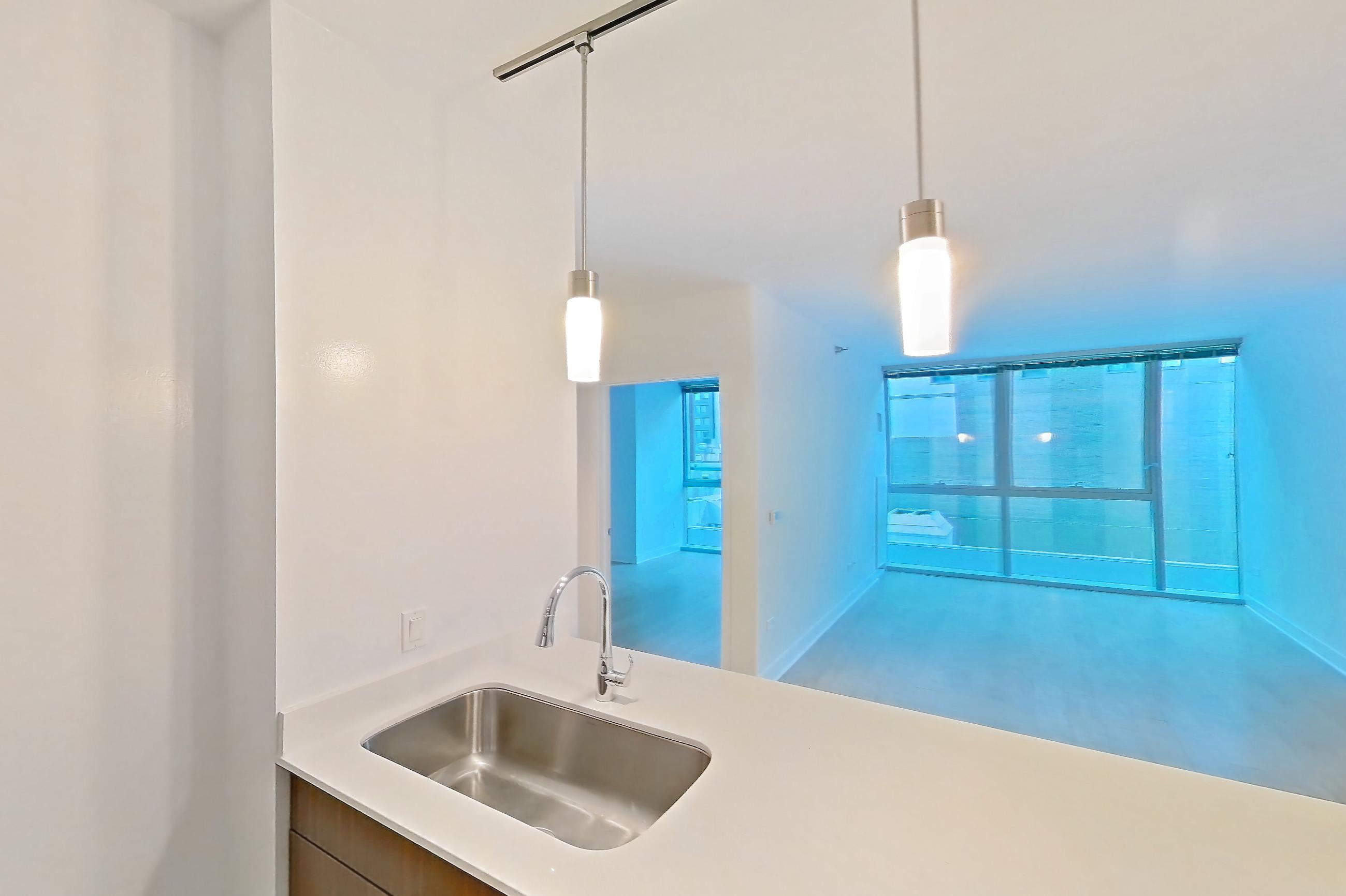 Kitchen in a 1C floor plan apartment, representative of Apartment 3303 at Mila