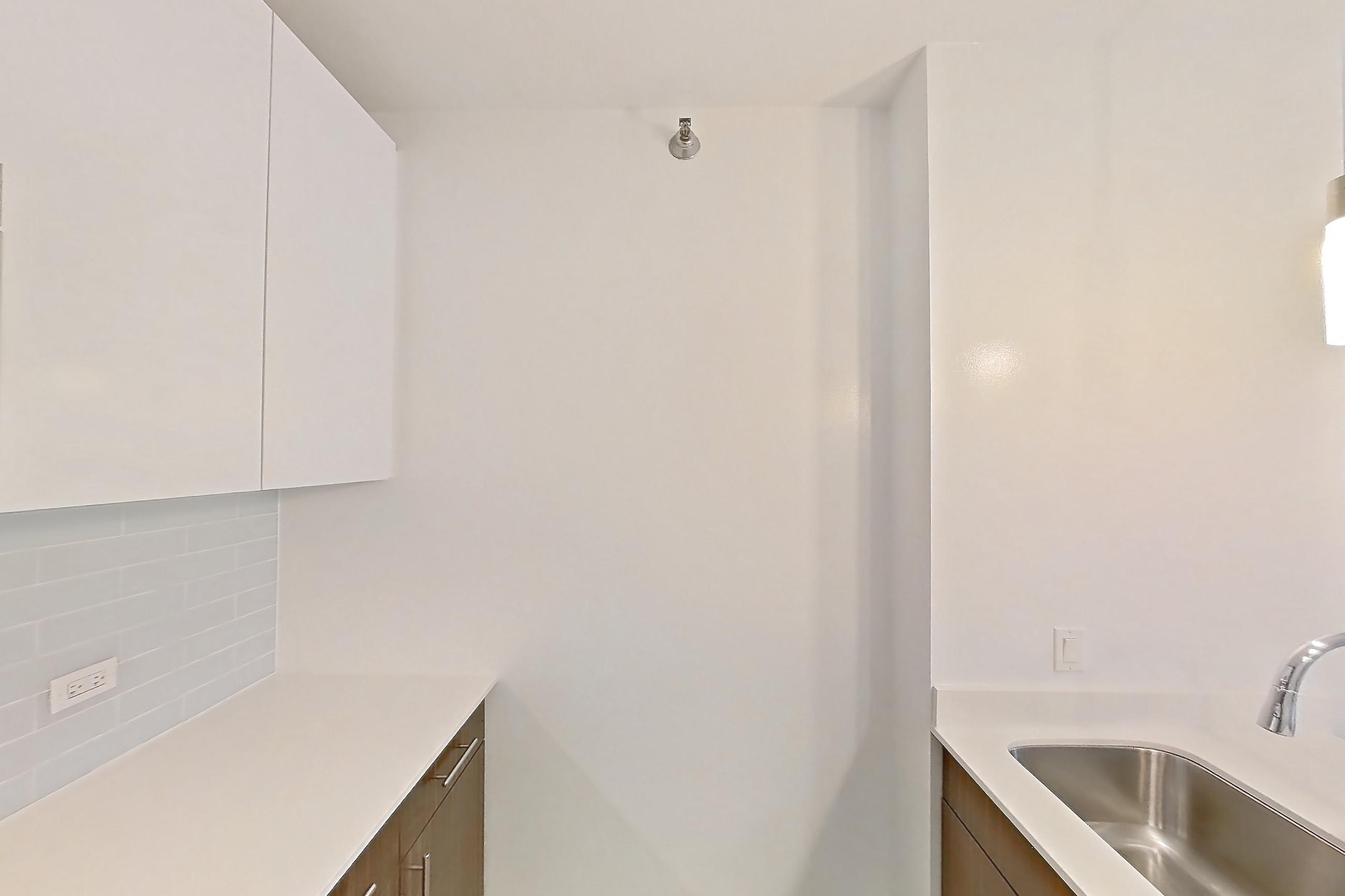 Kitchen in a 1C floor plan apartment, representative of Apartment 3303 at Mila