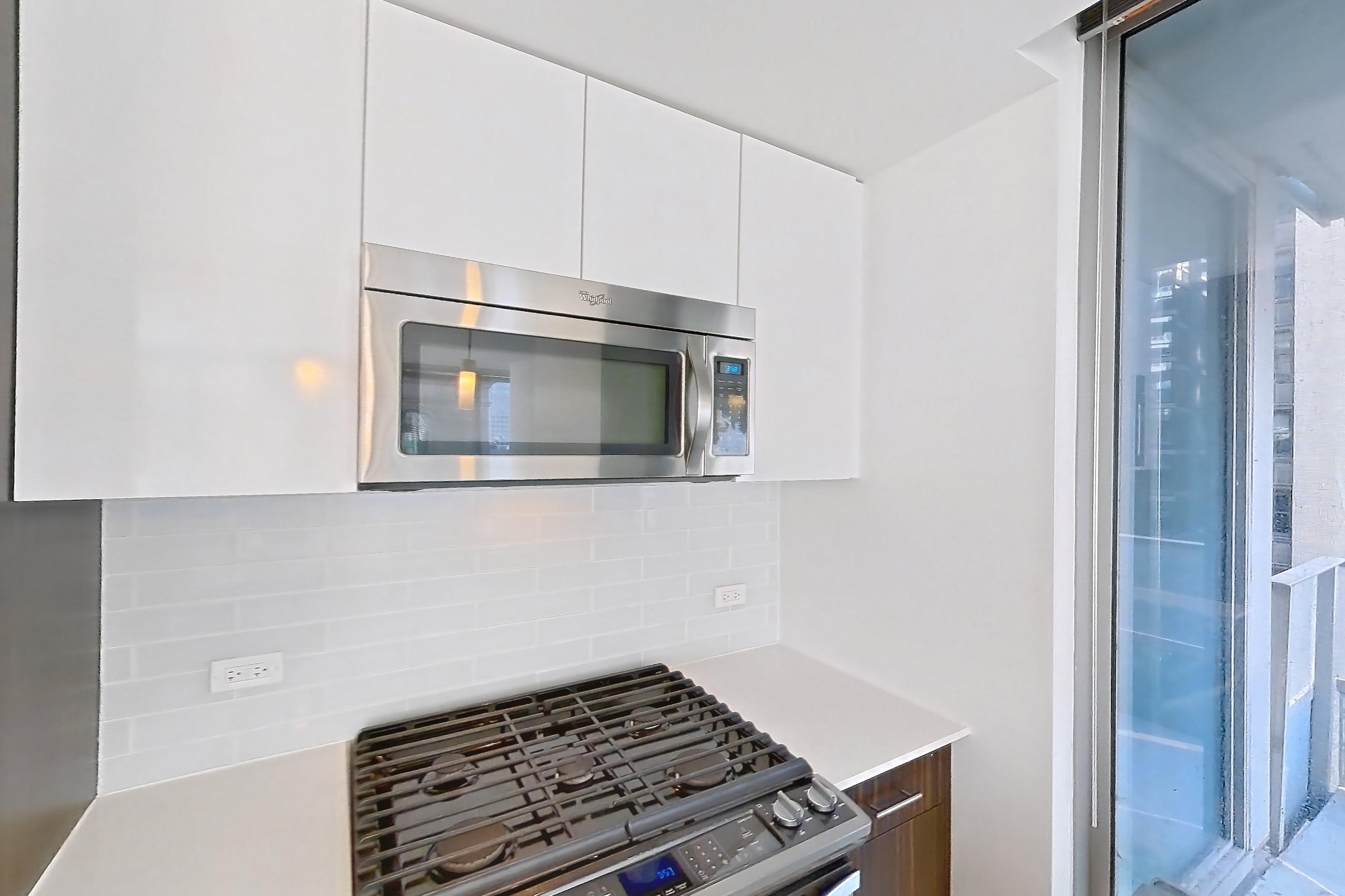 Kitchen in a 2A floor plan apartment, representative of Apartment 3307 at Mila