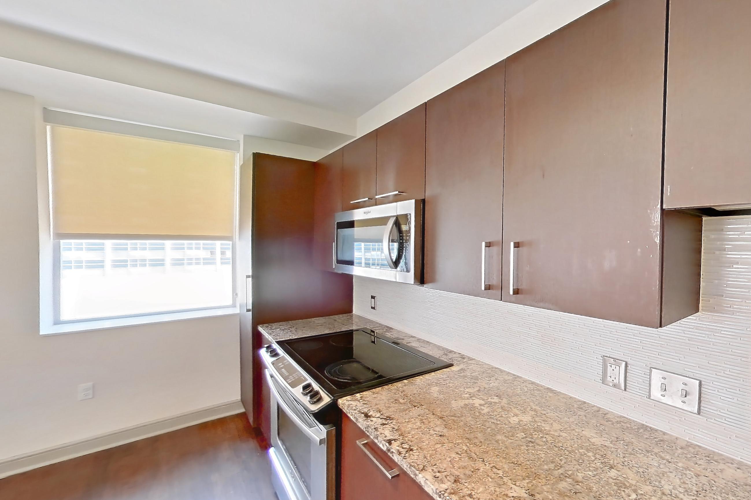Kitchen in a 1C floor plan apartment, representative of Apartment C-0821 at The Continental