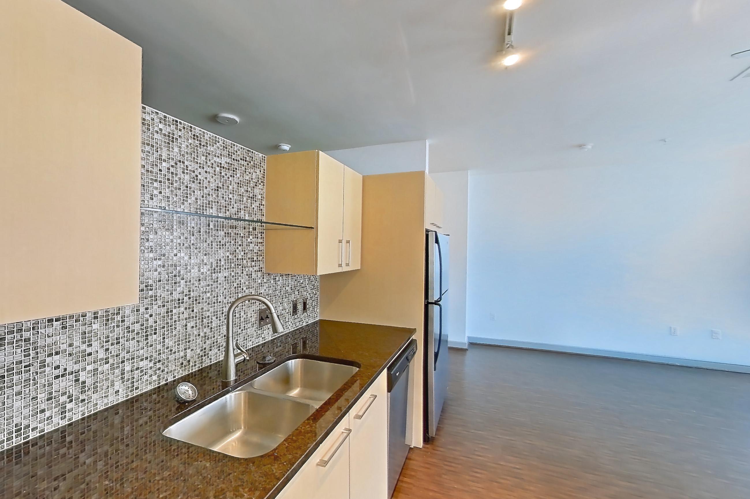 Kitchen in a 1F floor plan apartment, representative of Apartment C-0807 at The Continental