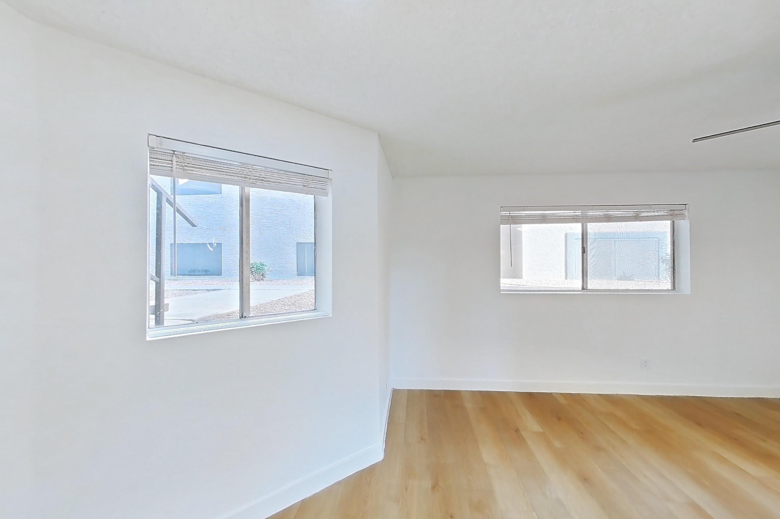 Dining room with light wood-finish flooring, Apartment 1091 at Terra Vida Apartments