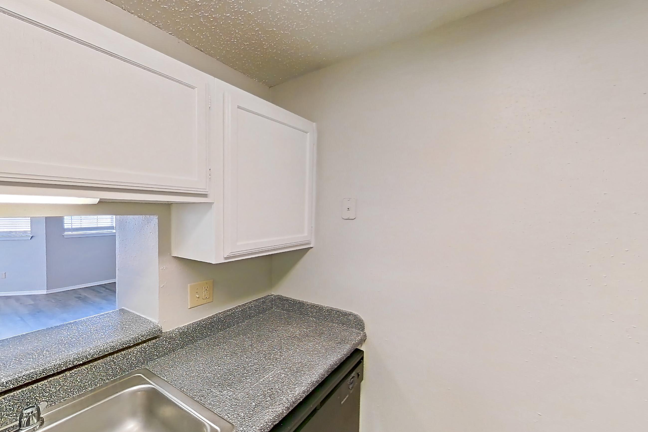 Kitchen in Apartment 19-1936 at The Arbors of Las Colinas, 1D floor plan