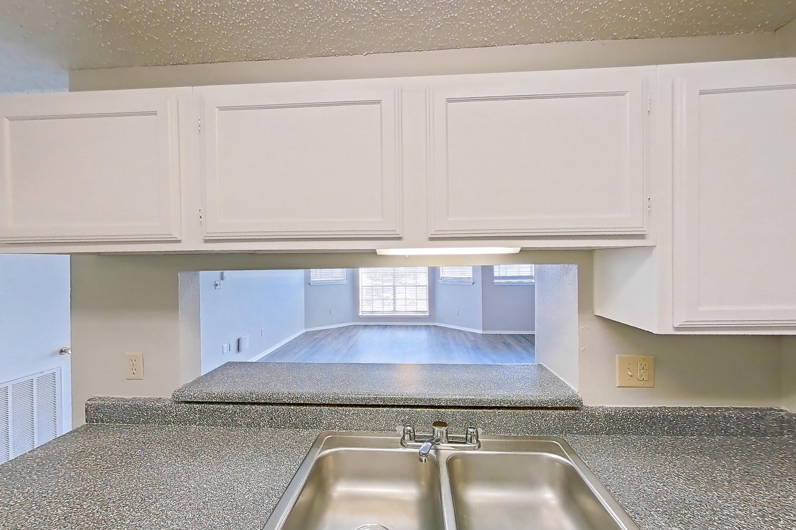 Kitchen in Apartment 19-1936 at The Arbors of Las Colinas, 1D floor plan