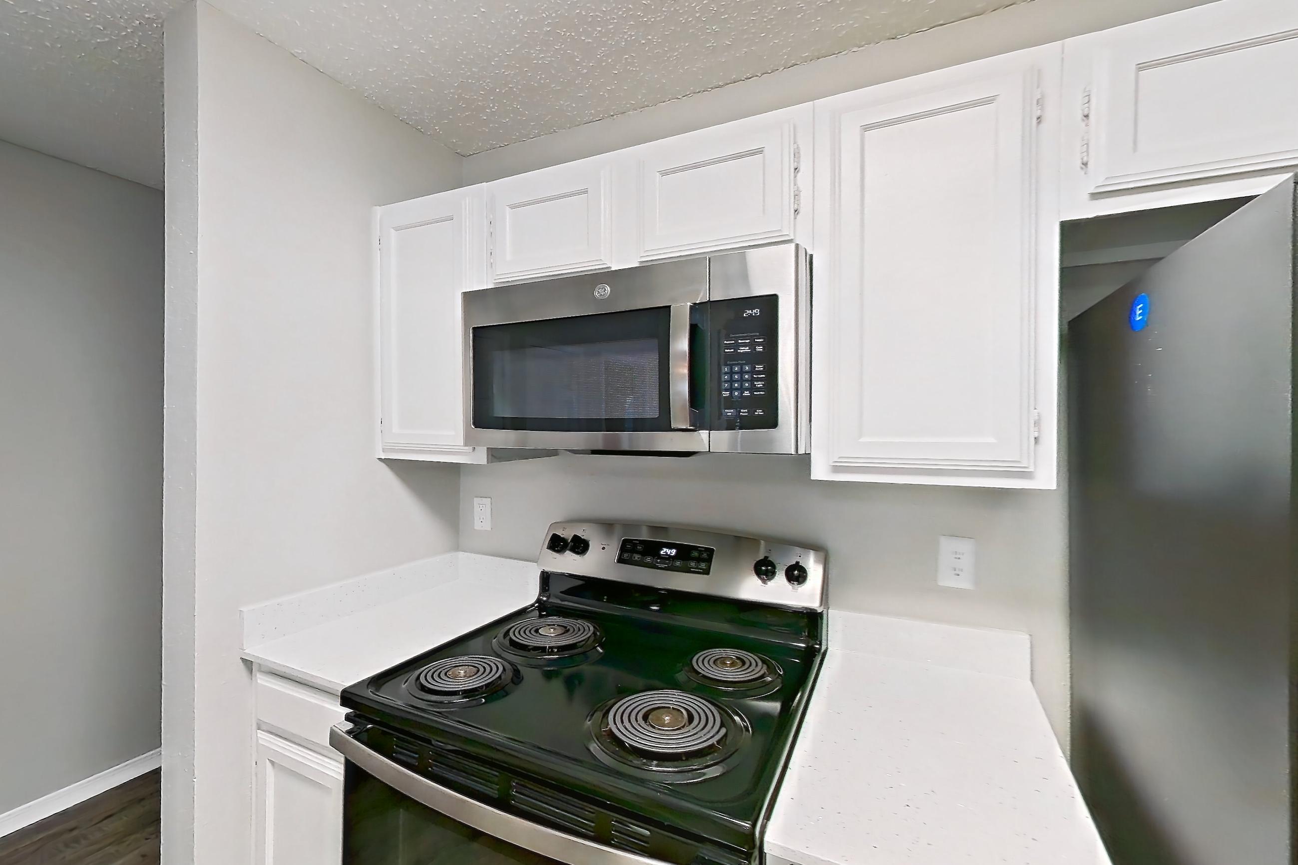 Kitchen in Apartment 21-2122 at The Arbors of Las Colinas, 2A floor plan