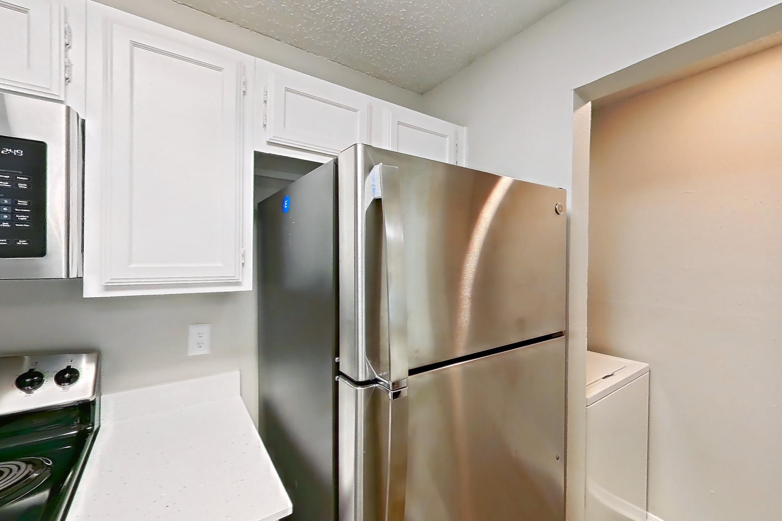 Kitchen in Apartment 21-2122 at The Arbors of Las Colinas, 2A floor plan