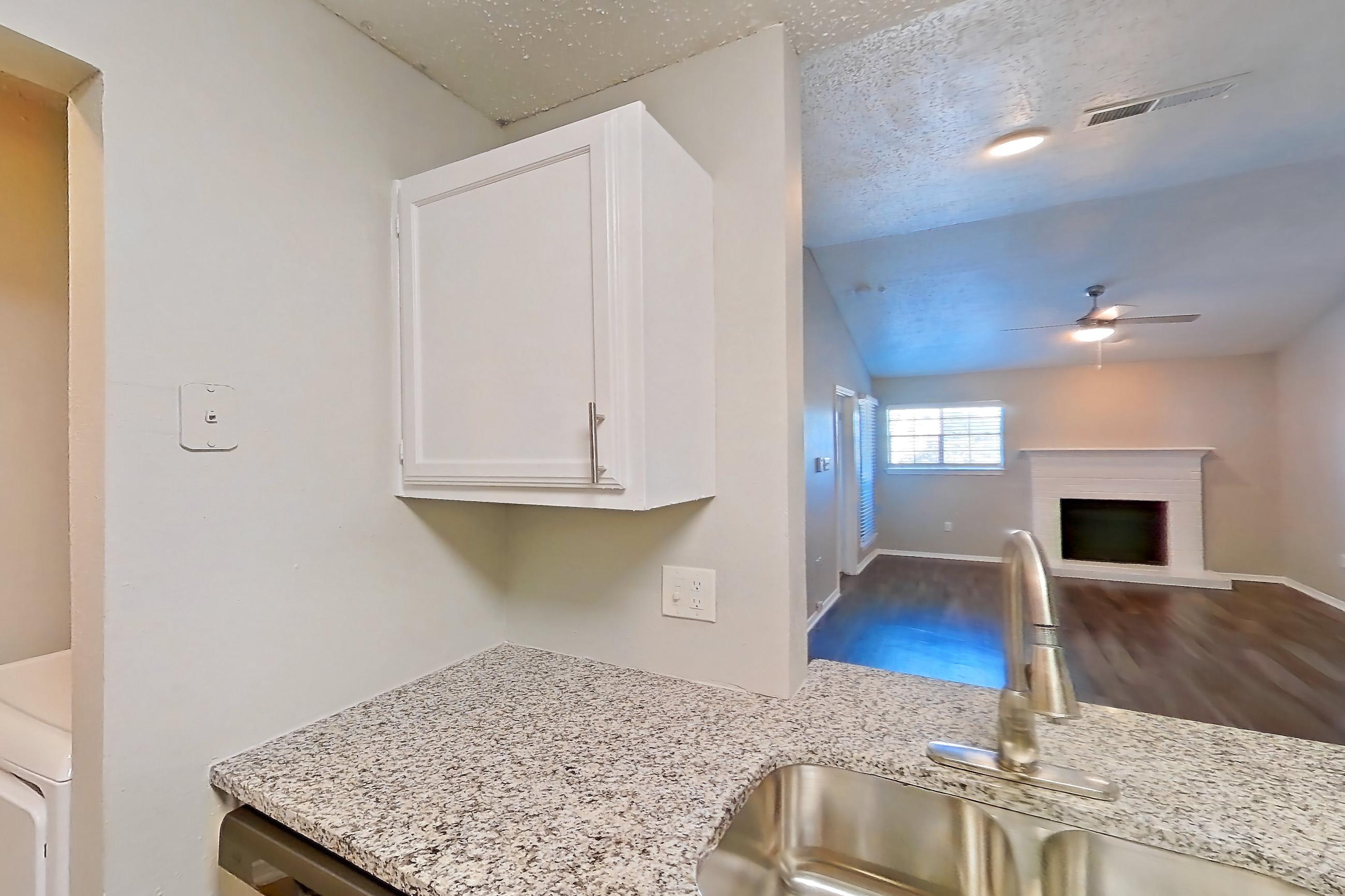 Kitchen in Apartment 13-1332 at The Arbors of Las Colinas, 2B floor plan