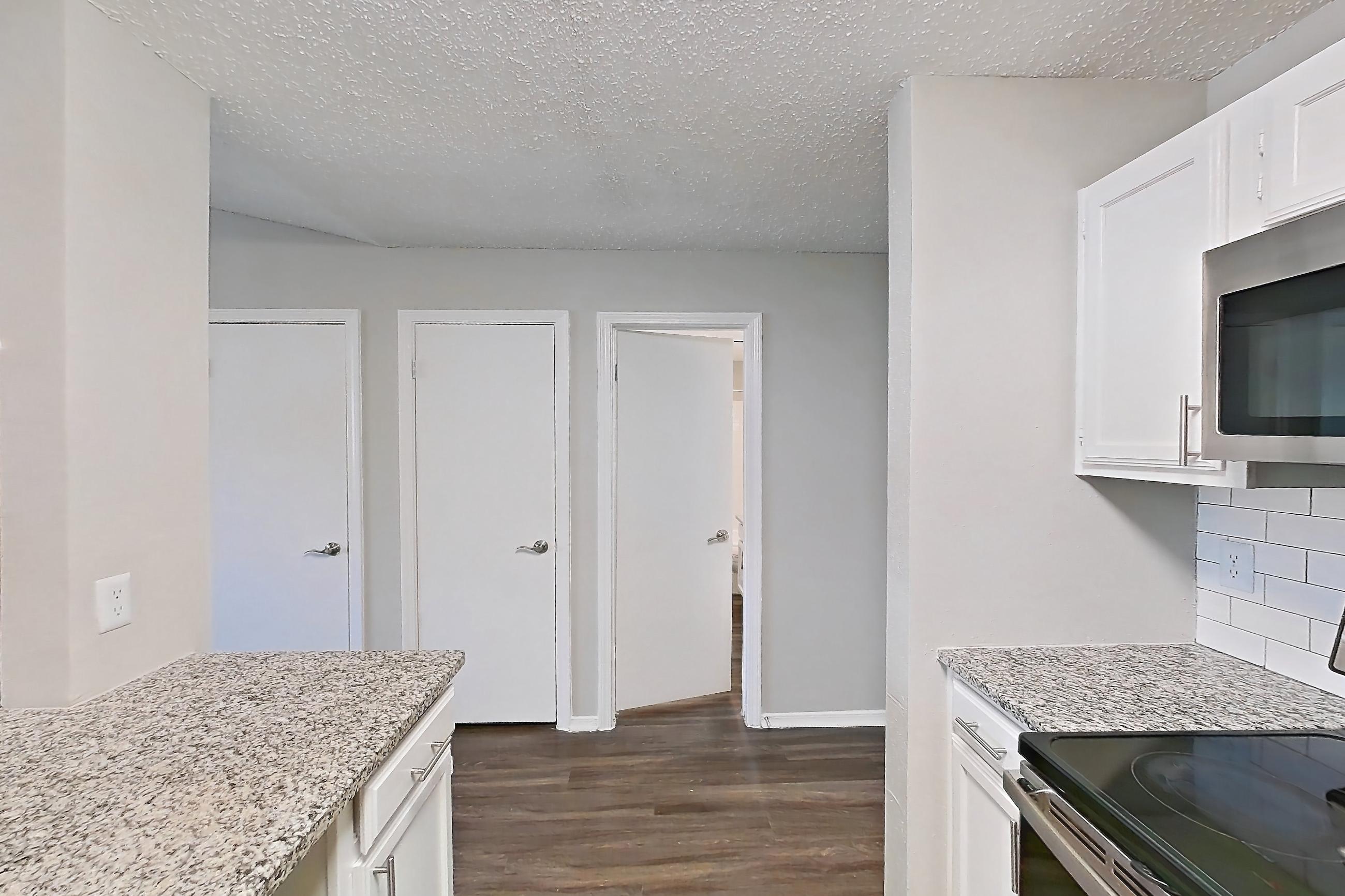 Kitchen in Apartment 13-1332 at The Arbors of Las Colinas, 2B floor plan