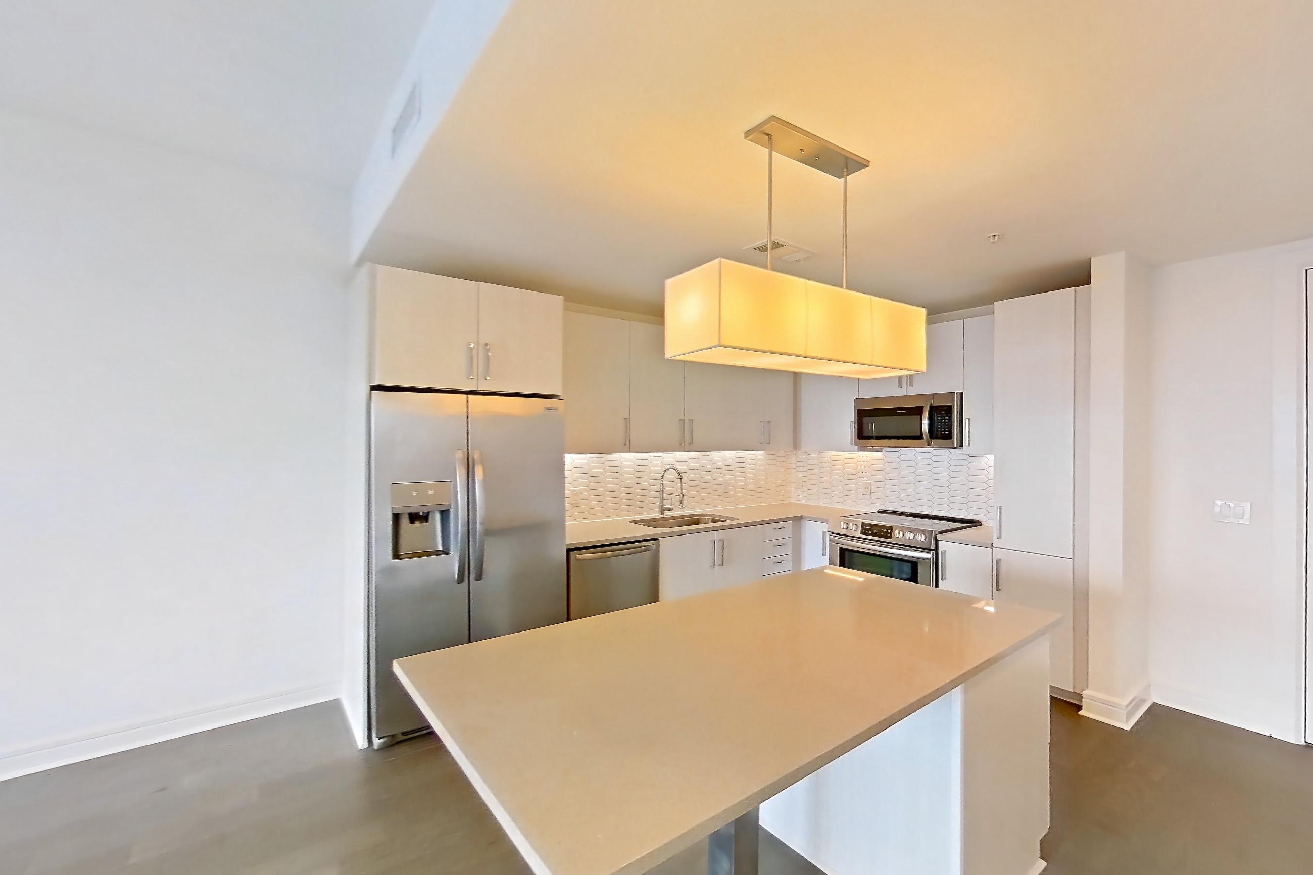 Living space in a A12 floor plan apartment, representative of Apartment 907 at Luminary Residences