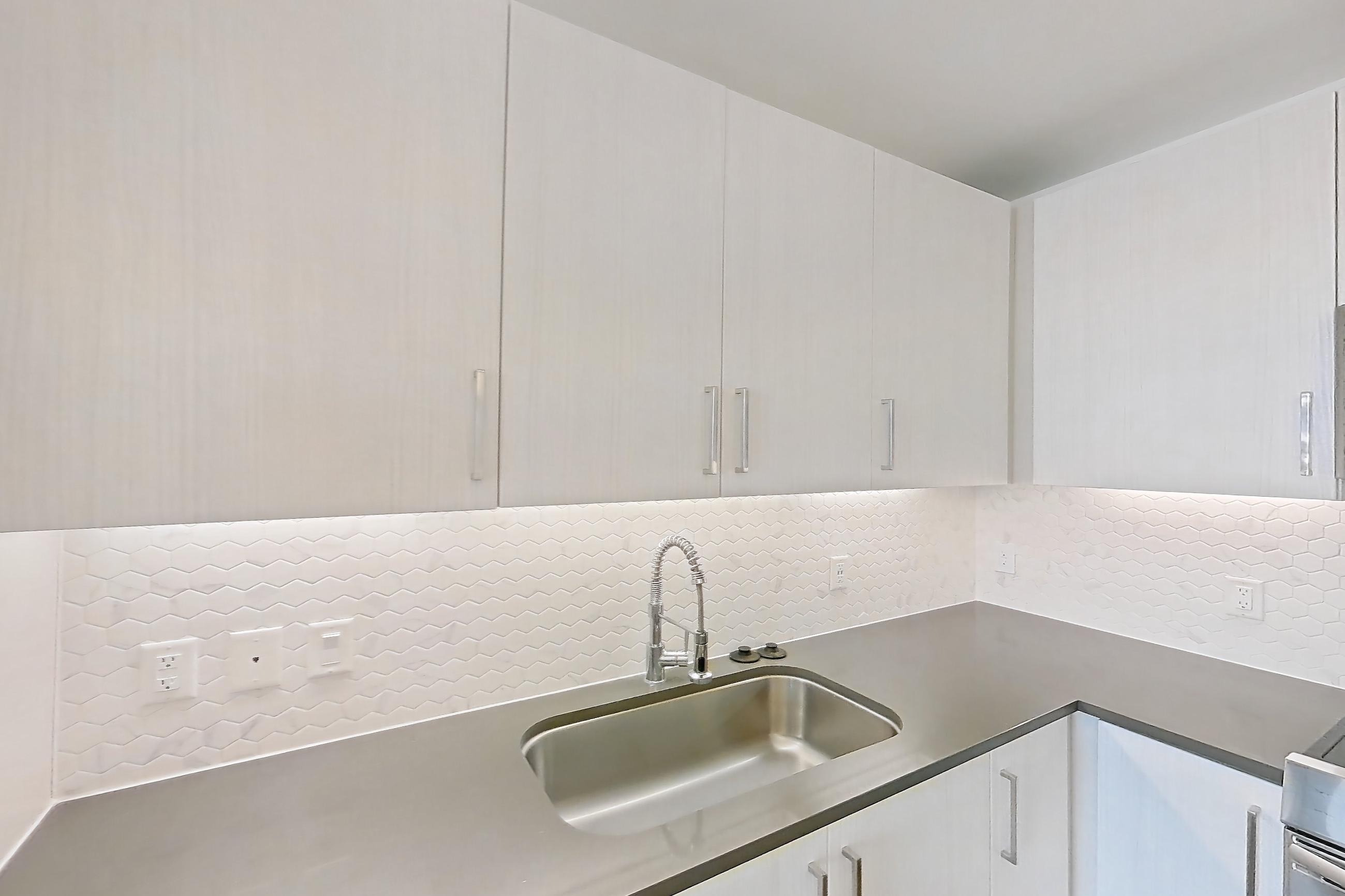 Kitchen in a A8 floor plan apartment, representative of Apartment 1008 at Luminary Residences