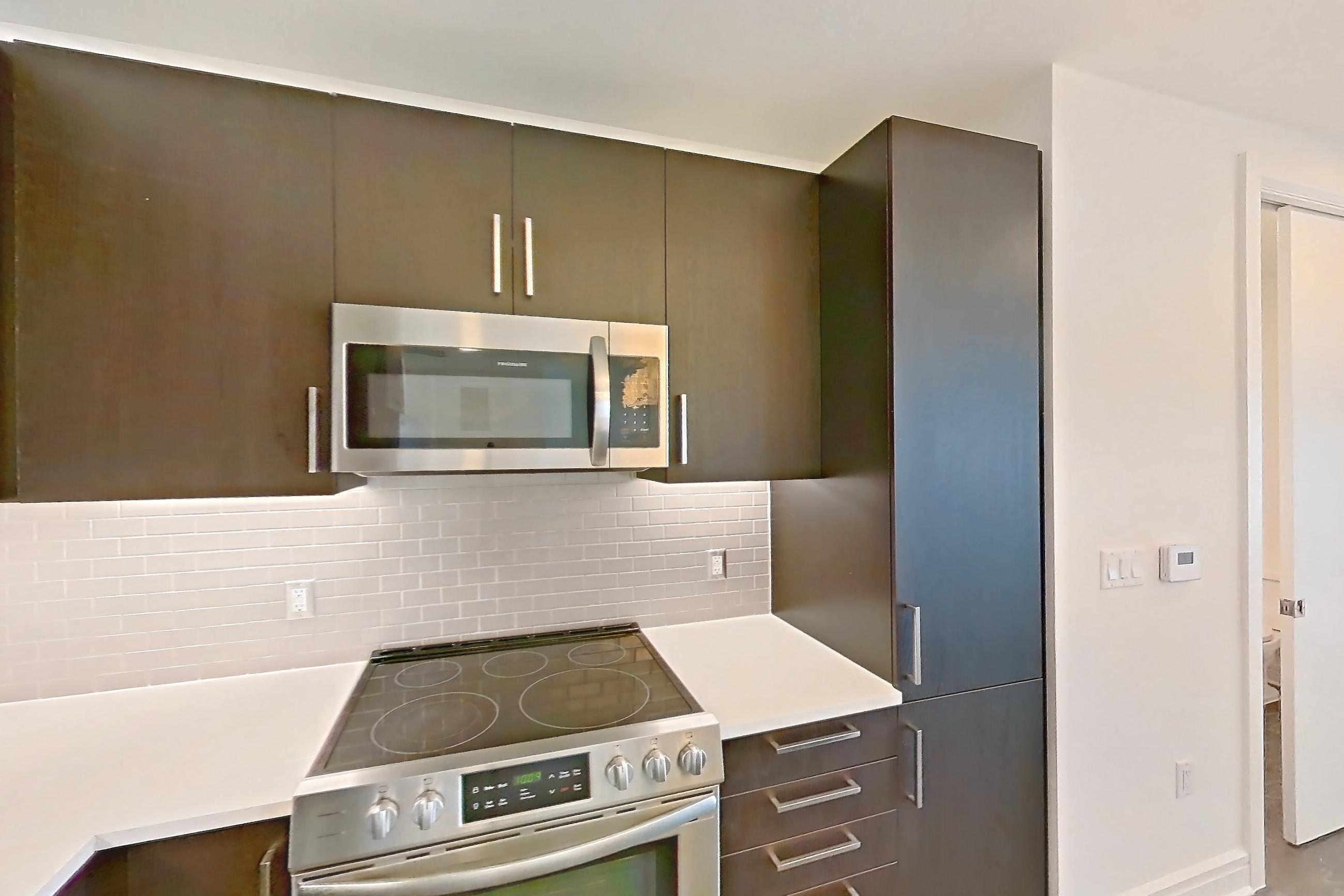 Kitchen in a B3 floor plan apartment, representative of Apartment 2210 at Luminary Residences