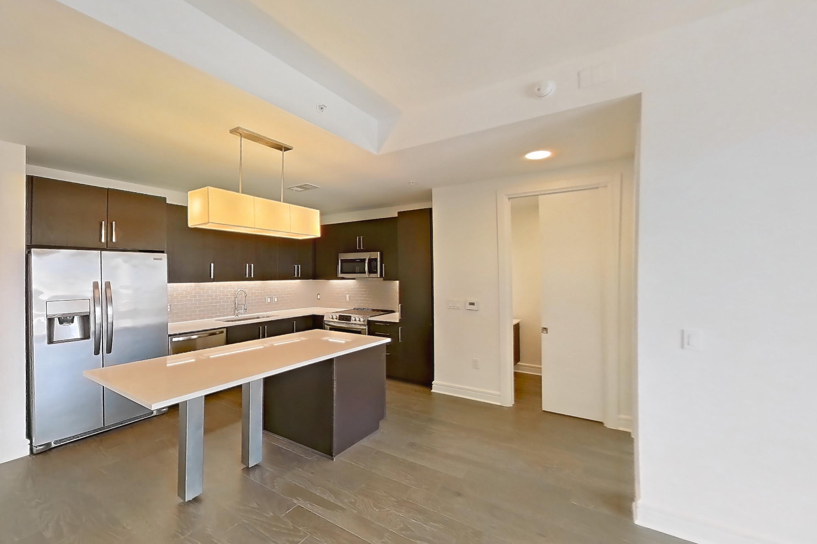 Living room in a B3 floor plan apartment, representative of Apartment 2210 at Luminary Residences