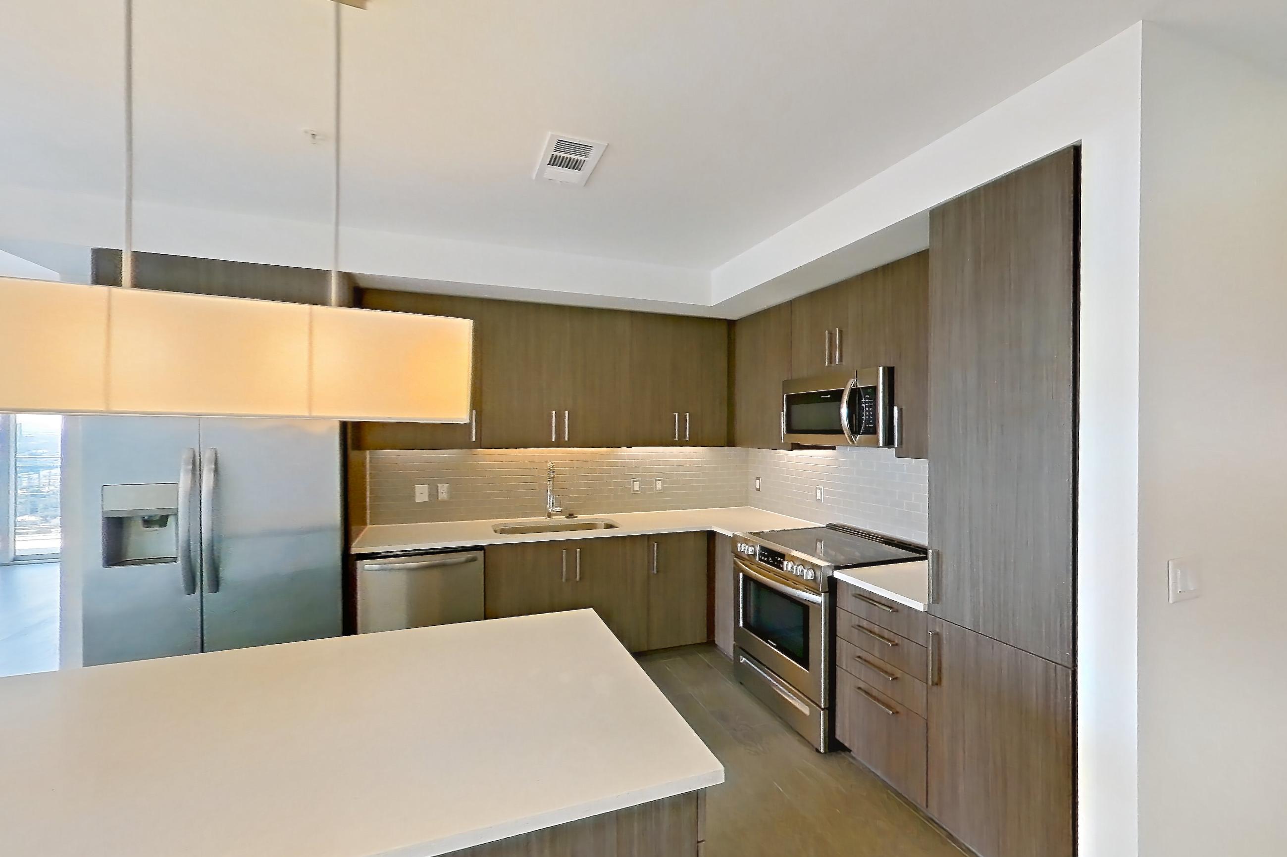 Kitchen space in a B4 floor plan apartment, representative of Apartment 2511 at Luminary Residences