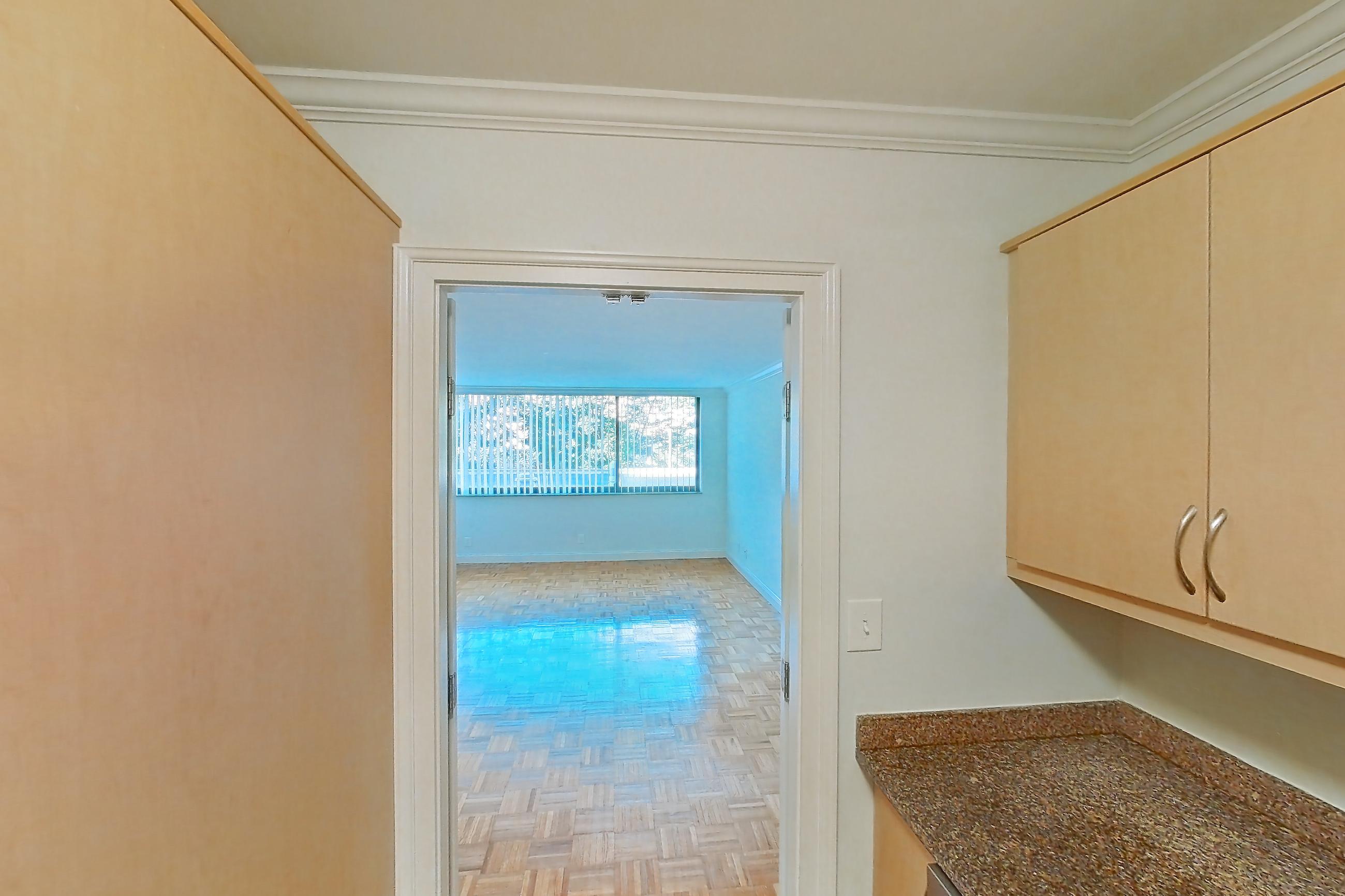 Kitchen with dark stone countertops, dishwasher, electric range, light tile flooring, light wood-finish flooring, oven/range, parquet flooring, refrigerator, and stainless steel appliances, Apartment 199-0208 at Church Park