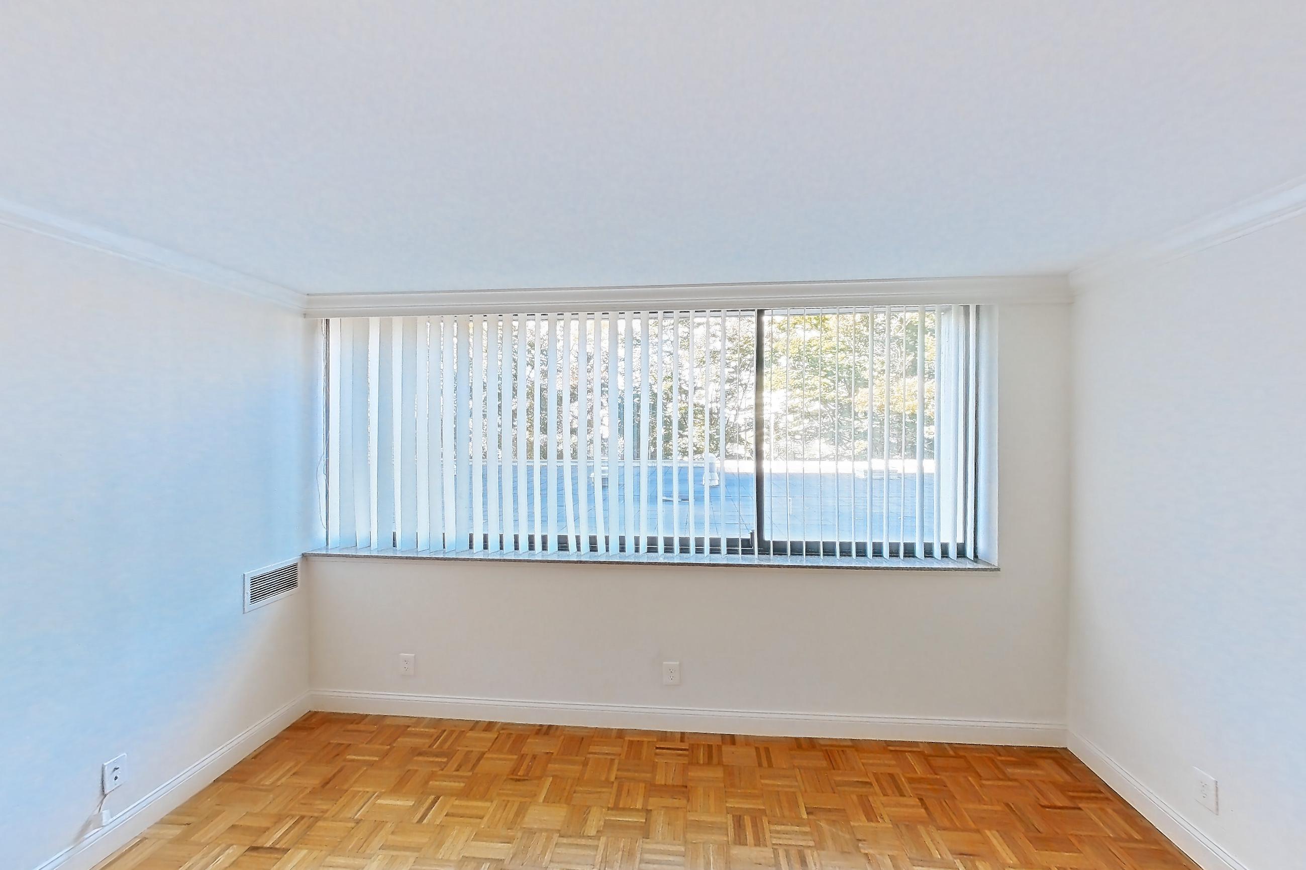 Living room with light wood-finish flooring and parquet flooring, Apartment 199-0208 at Church Park