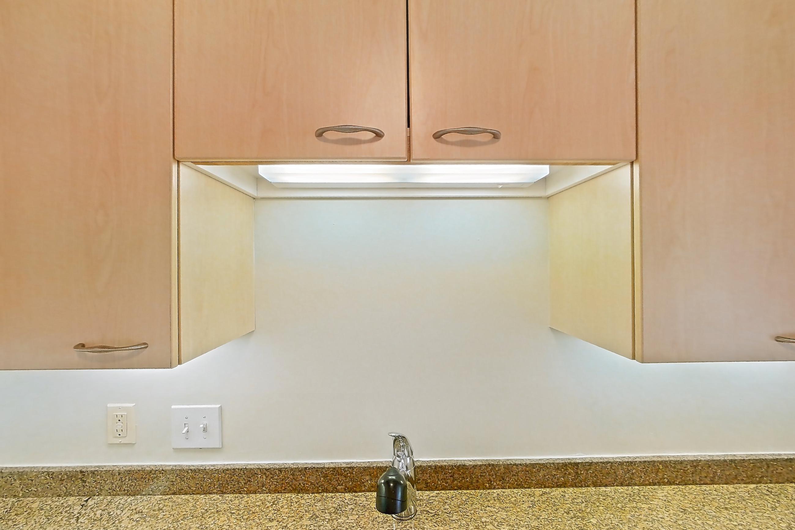 Kitchen with electric range, light stone countertops, light tile flooring, oven/range, and white appliances, Apartment 199-0604 at Church Park