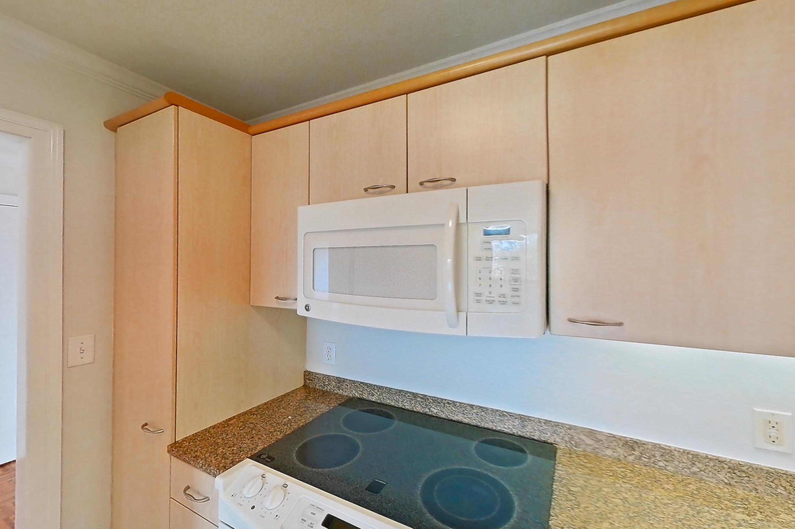 Kitchen with electric range, light stone countertops, light tile flooring, oven/range, and white appliances, Apartment 199-0604 at Church Park