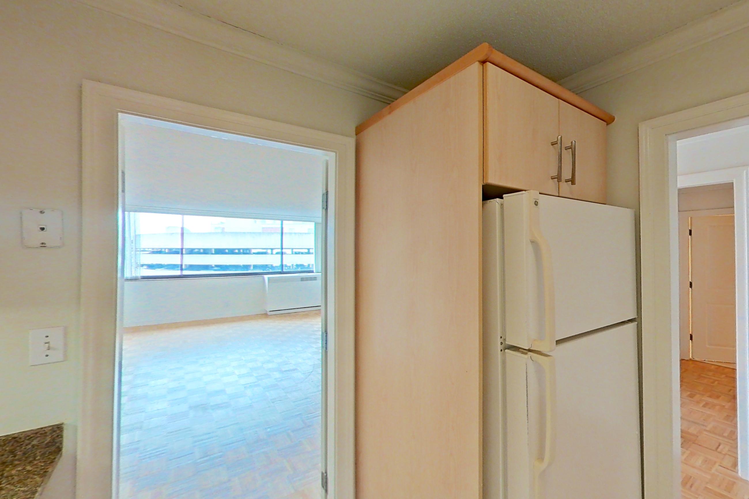 Kitchen with dark stone countertops, electric range, light tile flooring, oven/range, and white appliances, Apartment 255-0514 at Church Park