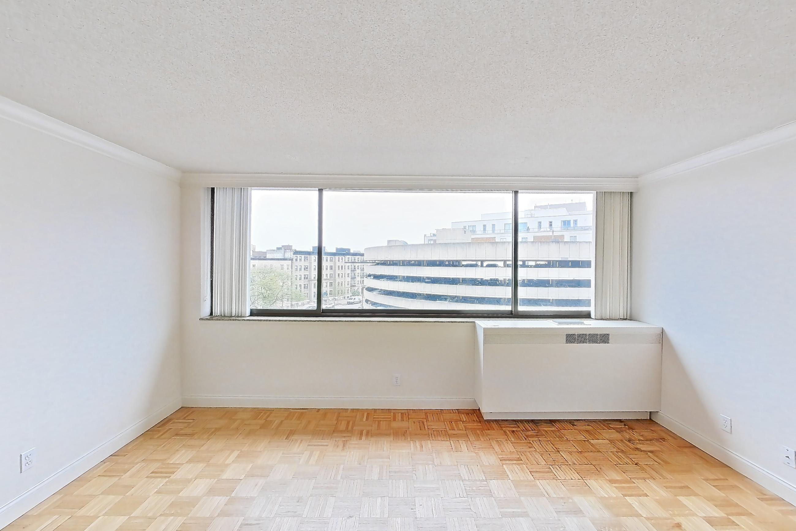 Living room with light wood-finish flooring and parquet flooring, Apartment 255-0514 at Church Park