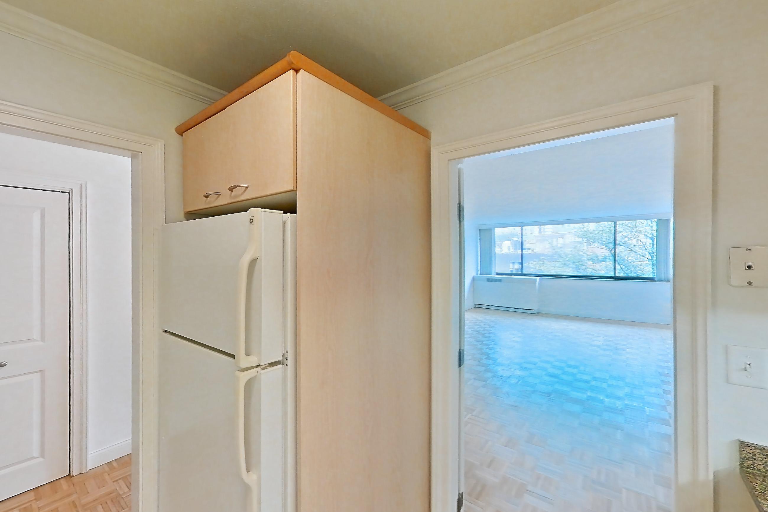 Kitchen with electric range, light stone countertops, light tile flooring, oven/range, and white appliances, Apartment 199-0311 at Church Park