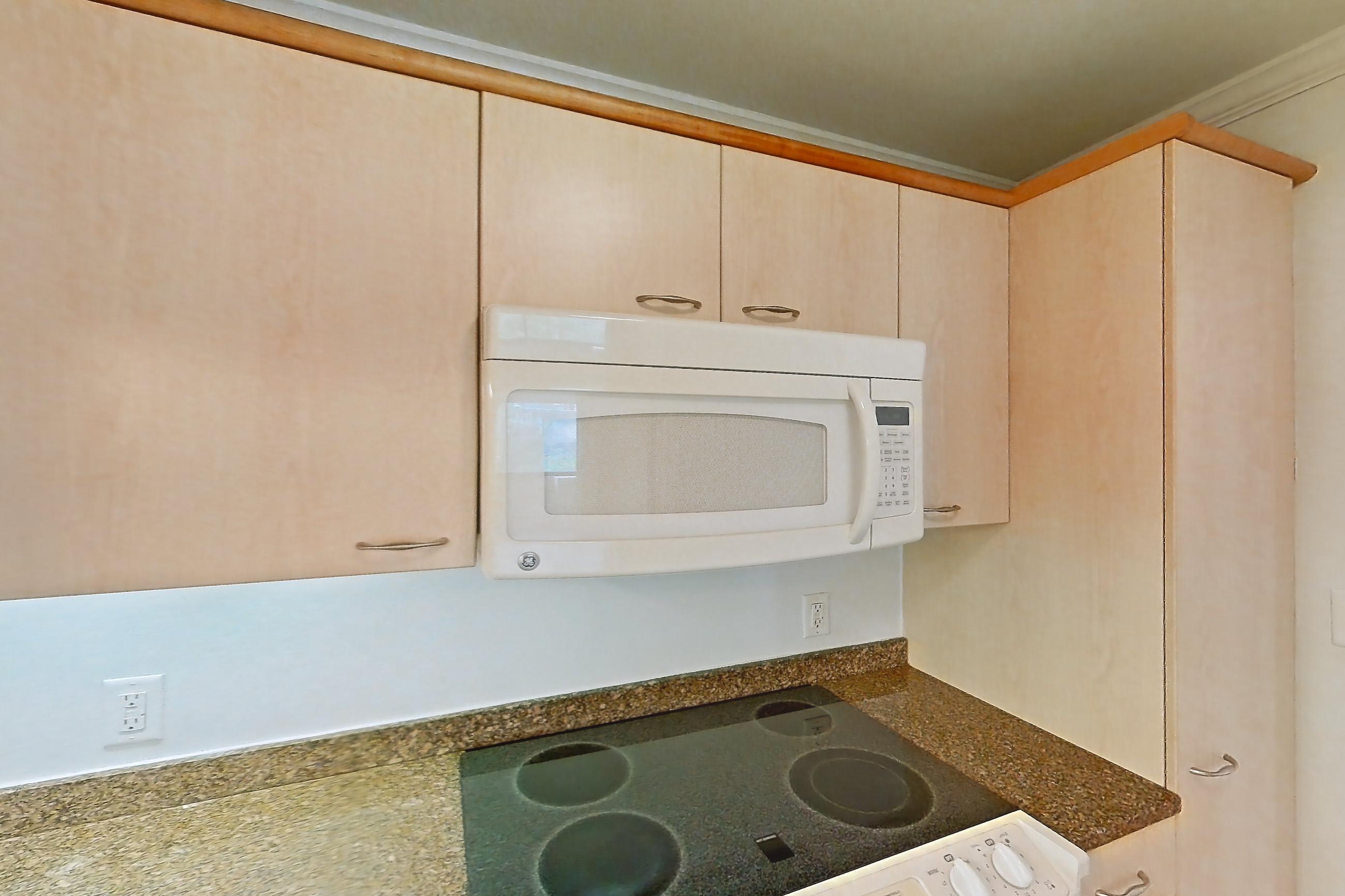 Kitchen with electric range, light stone countertops, light tile flooring, oven/range, and white appliances, Apartment 199-0311 at Church Park
