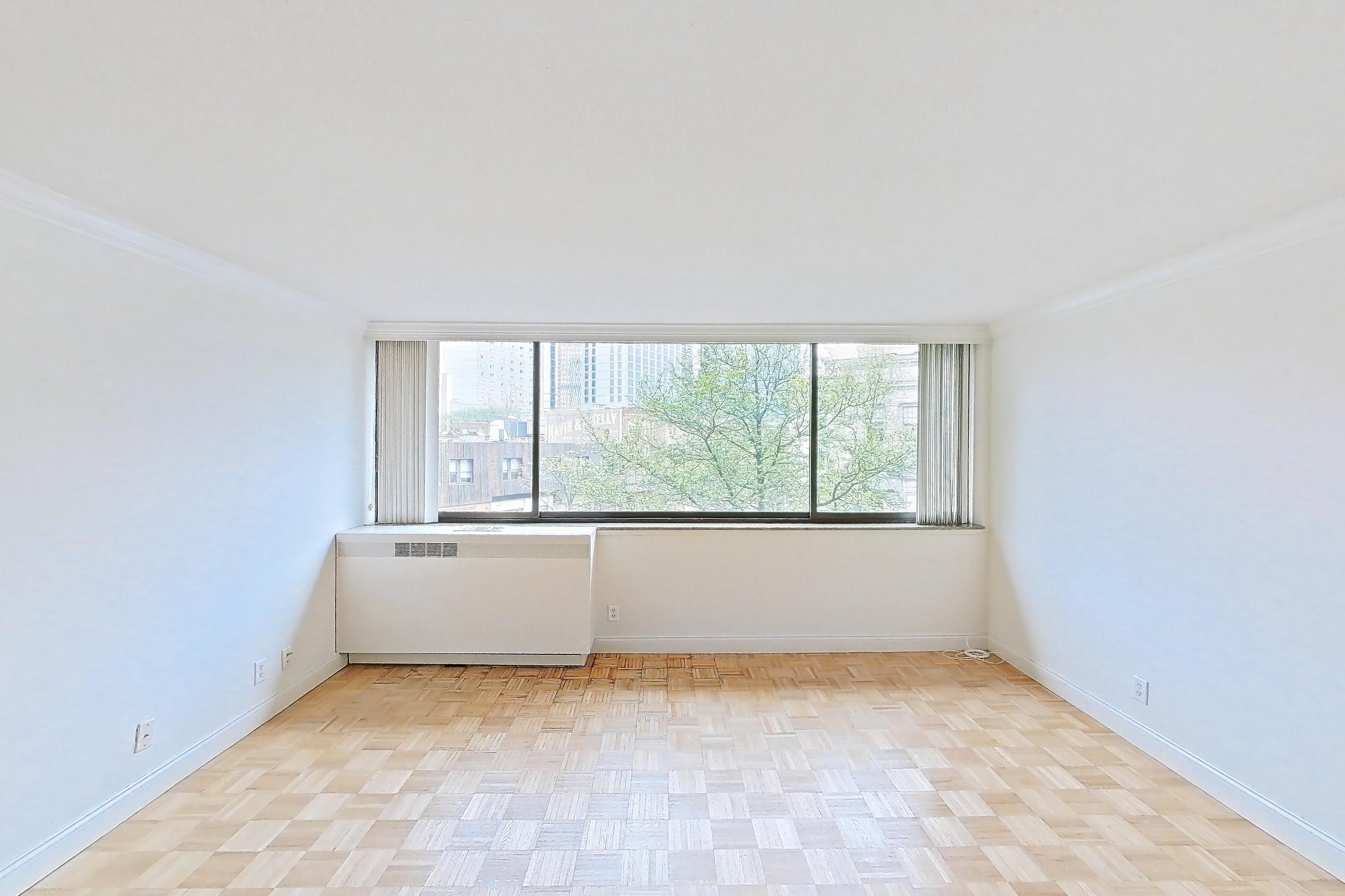 Living room with light wood-finish flooring and parquet flooring, Apartment 199-0311 at Church Park