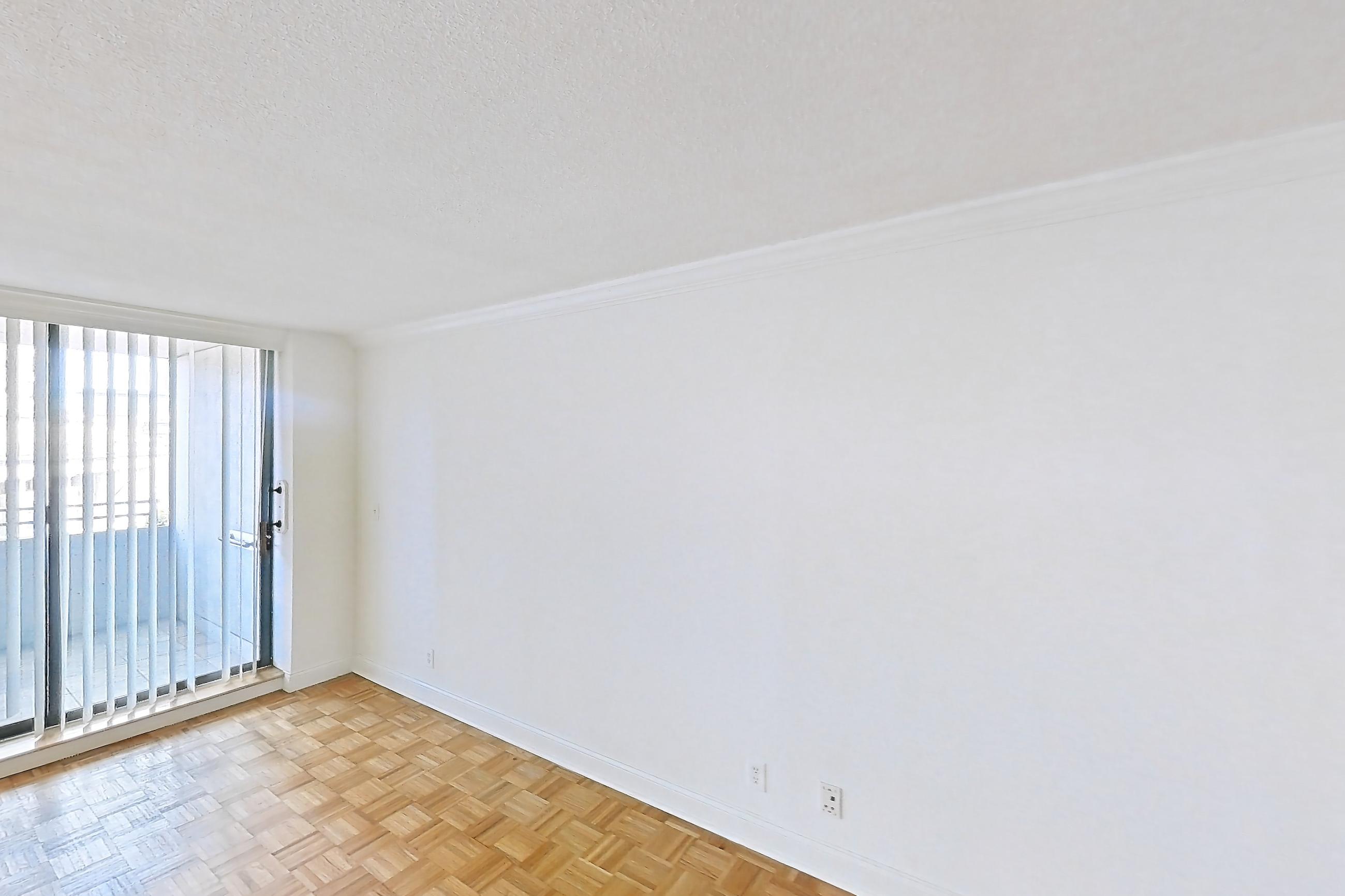 Living room with light wood-finish flooring and parquet flooring, Apartment 221-0618 at Church Park