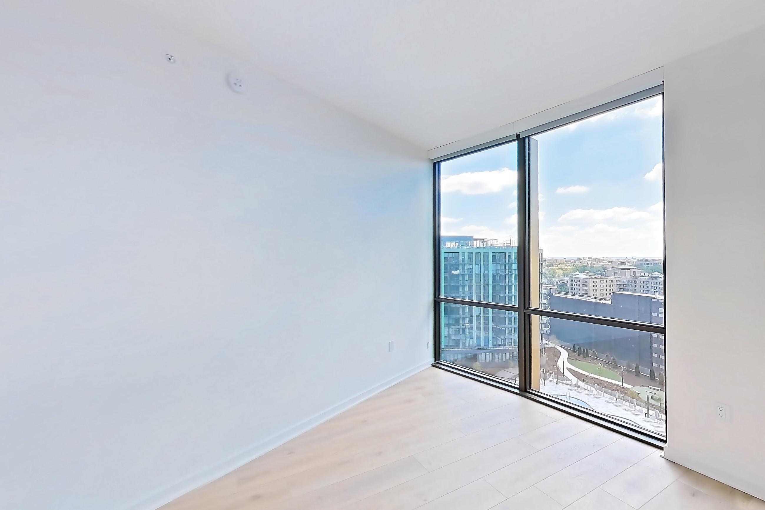 Living room with city view, light wood-finish flooring, and wood-finish flooring, Apartment 1633 at Zephyr