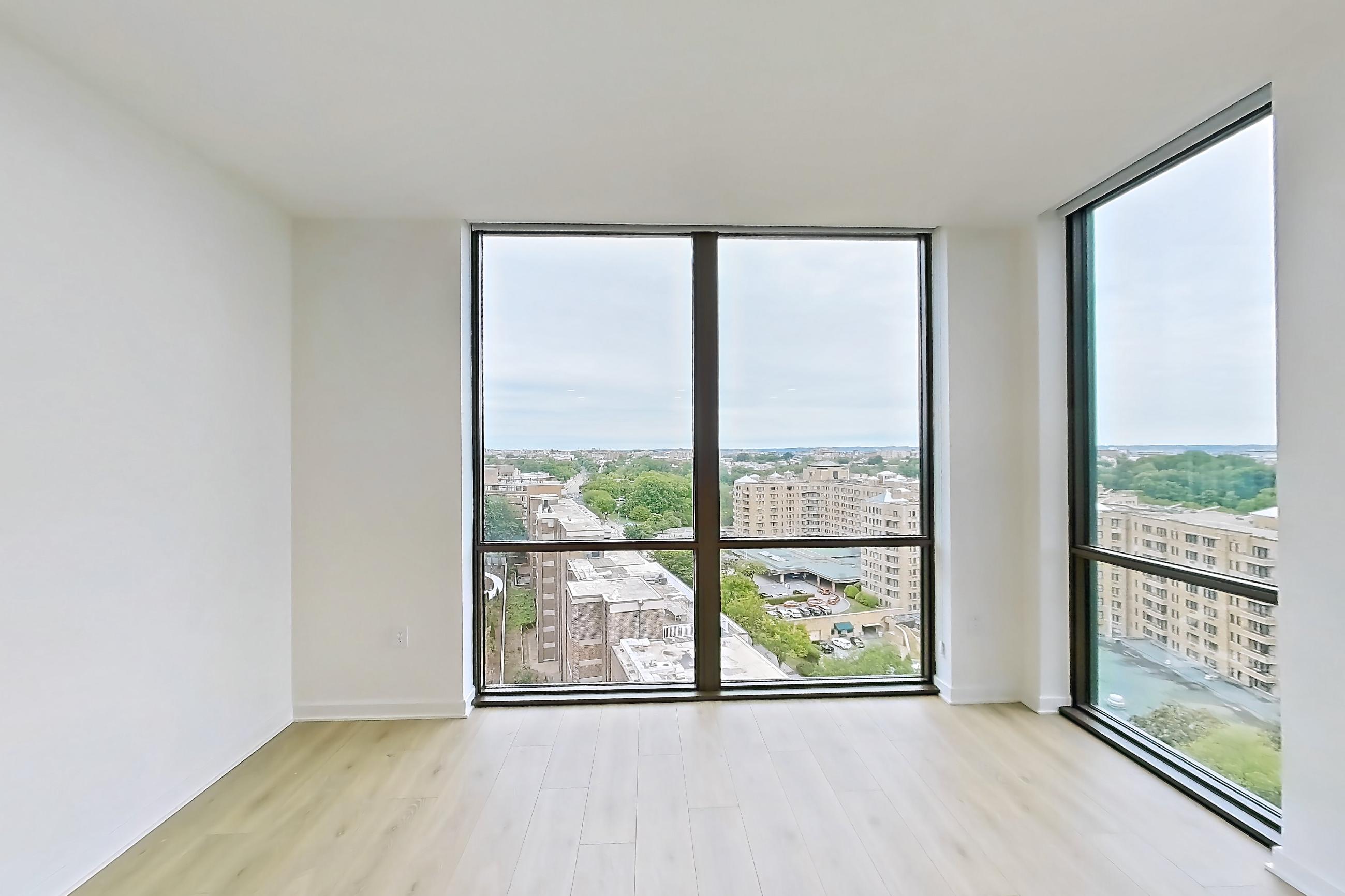 Living room with city view, light wood-finish flooring, and wood-finish flooring, Apartment 1605 at Zephyr