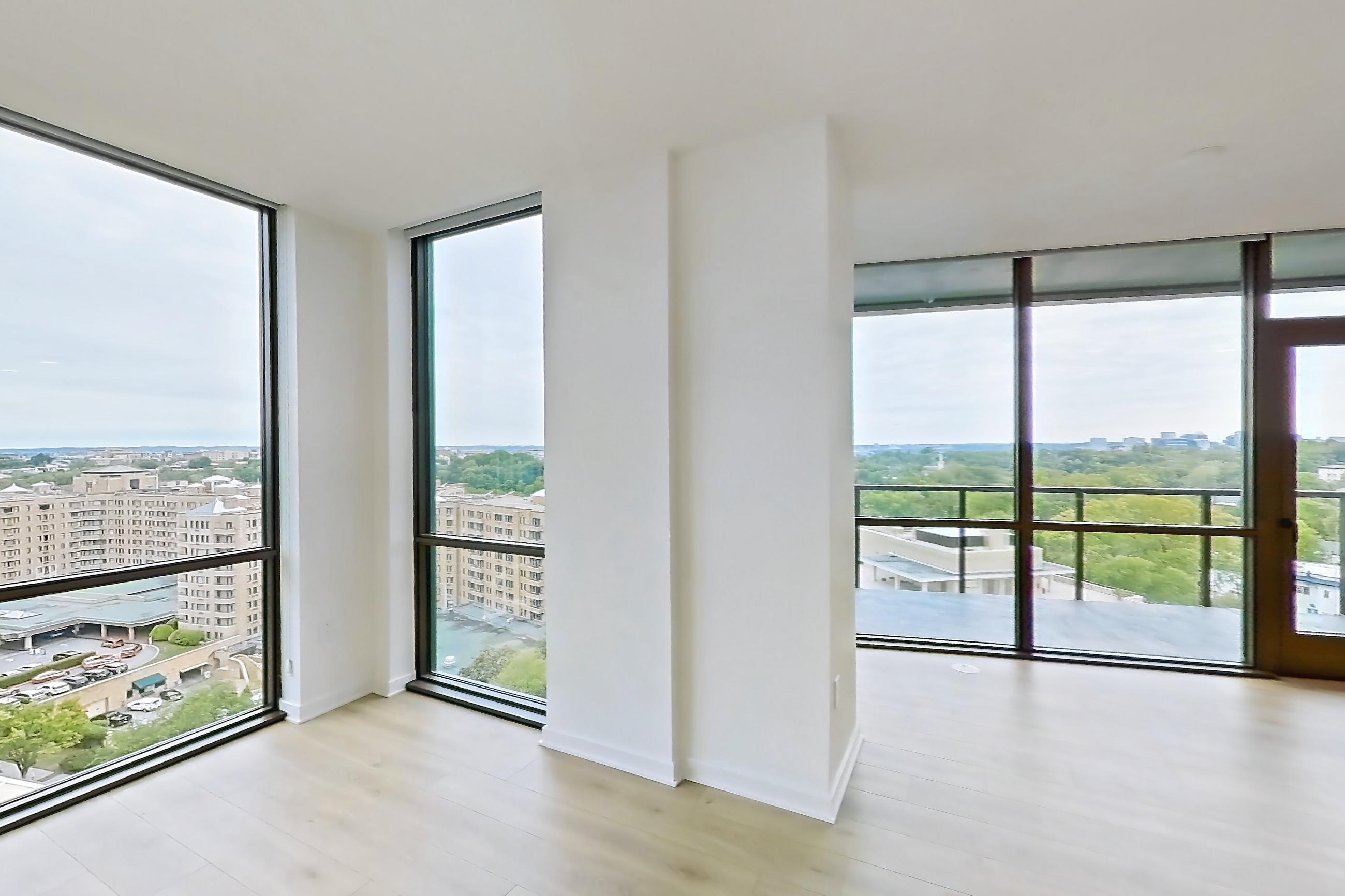 Living room with city view, light wood-finish flooring, and wood-finish flooring, Apartment 1605 at Zephyr