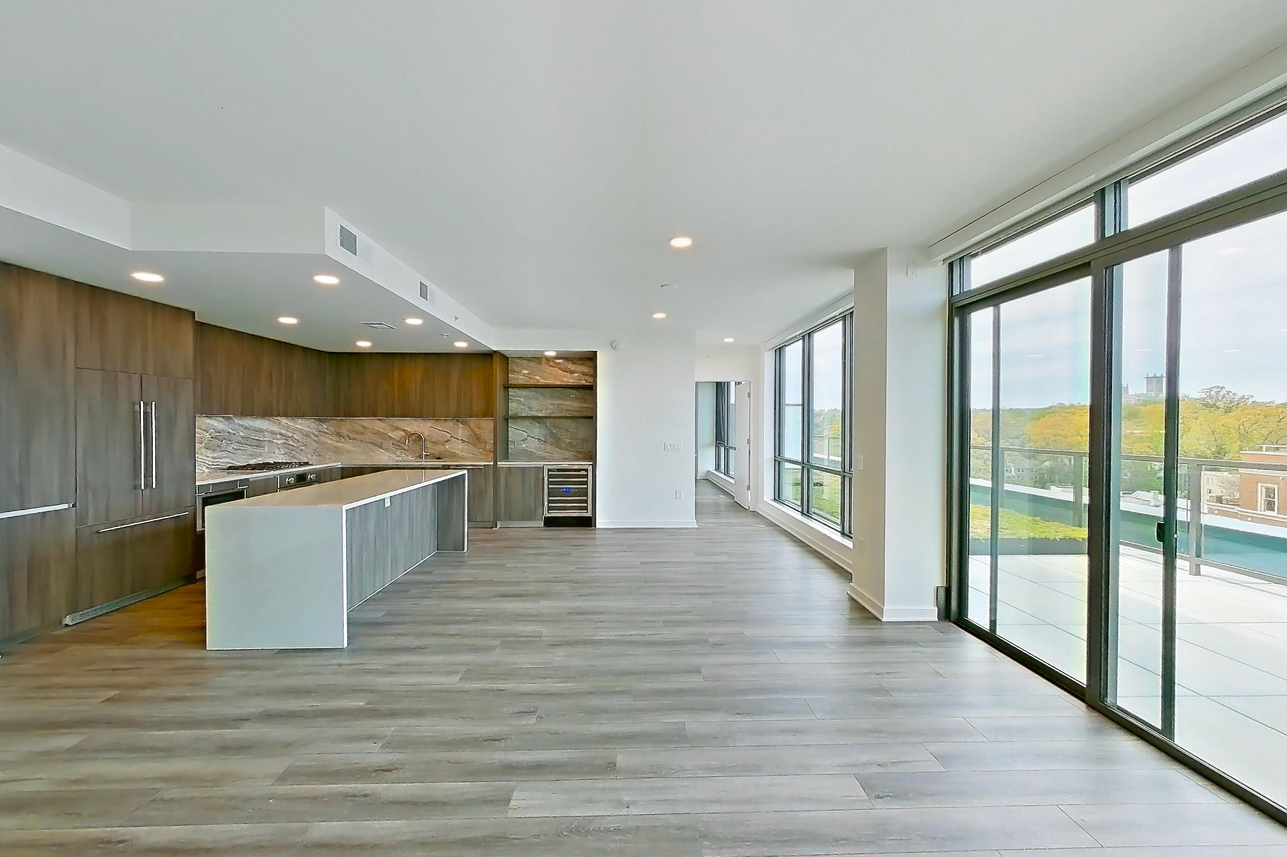 Living room with light wood-finish flooring, Apartment 1704 at Zephyr