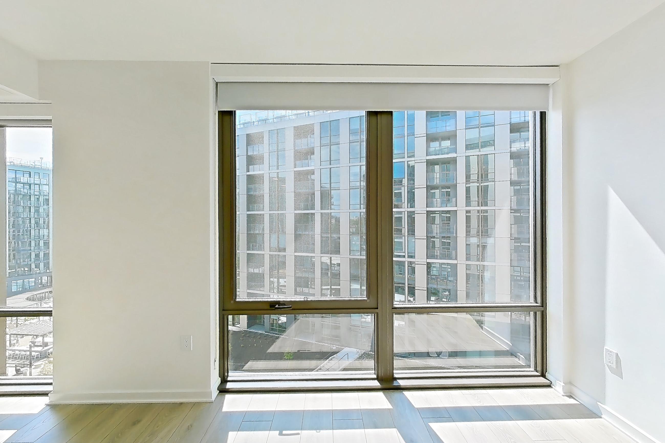 Living space with city view and light wood-finish flooring, Apartment 1235 at Zephyr