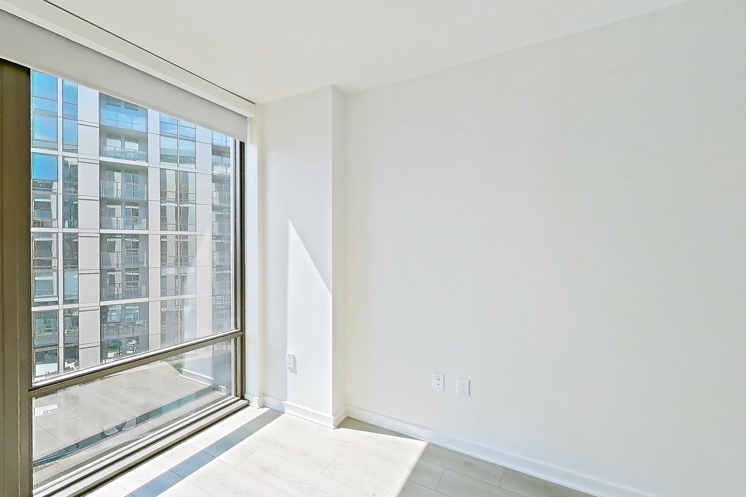 Living space with city view and light wood-finish flooring, Apartment 1235 at Zephyr