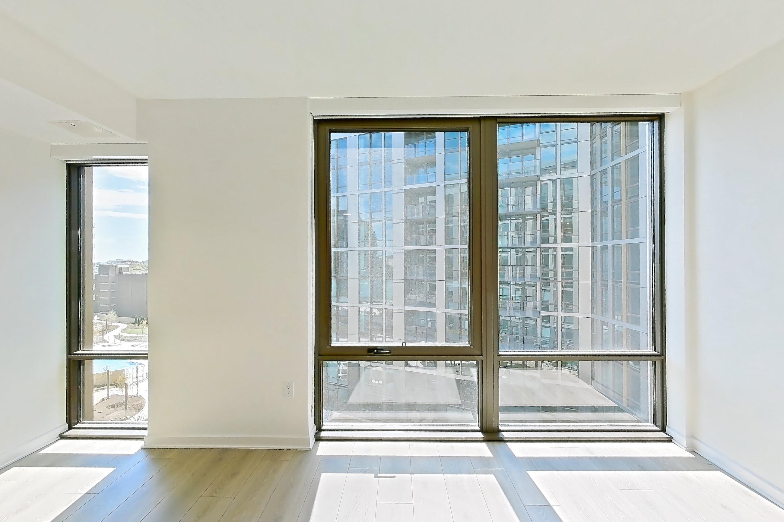 Living space with city view and light wood-finish flooring, Apartment 1237 at Zephyr