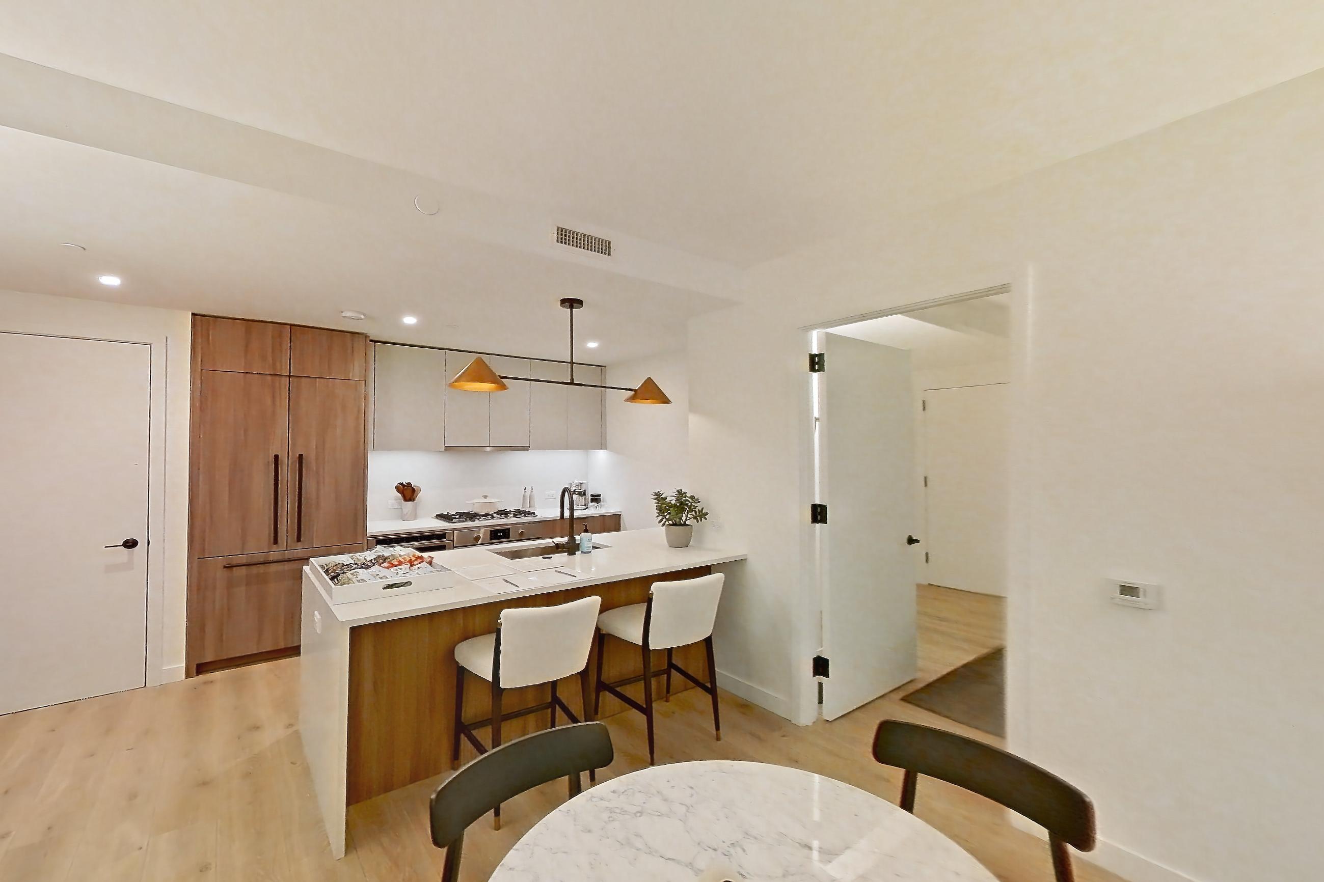 Living room with cooktop, gas cooktop, light wood-finish flooring, and stainless steel appliances, Apartment 03F at Maison 78