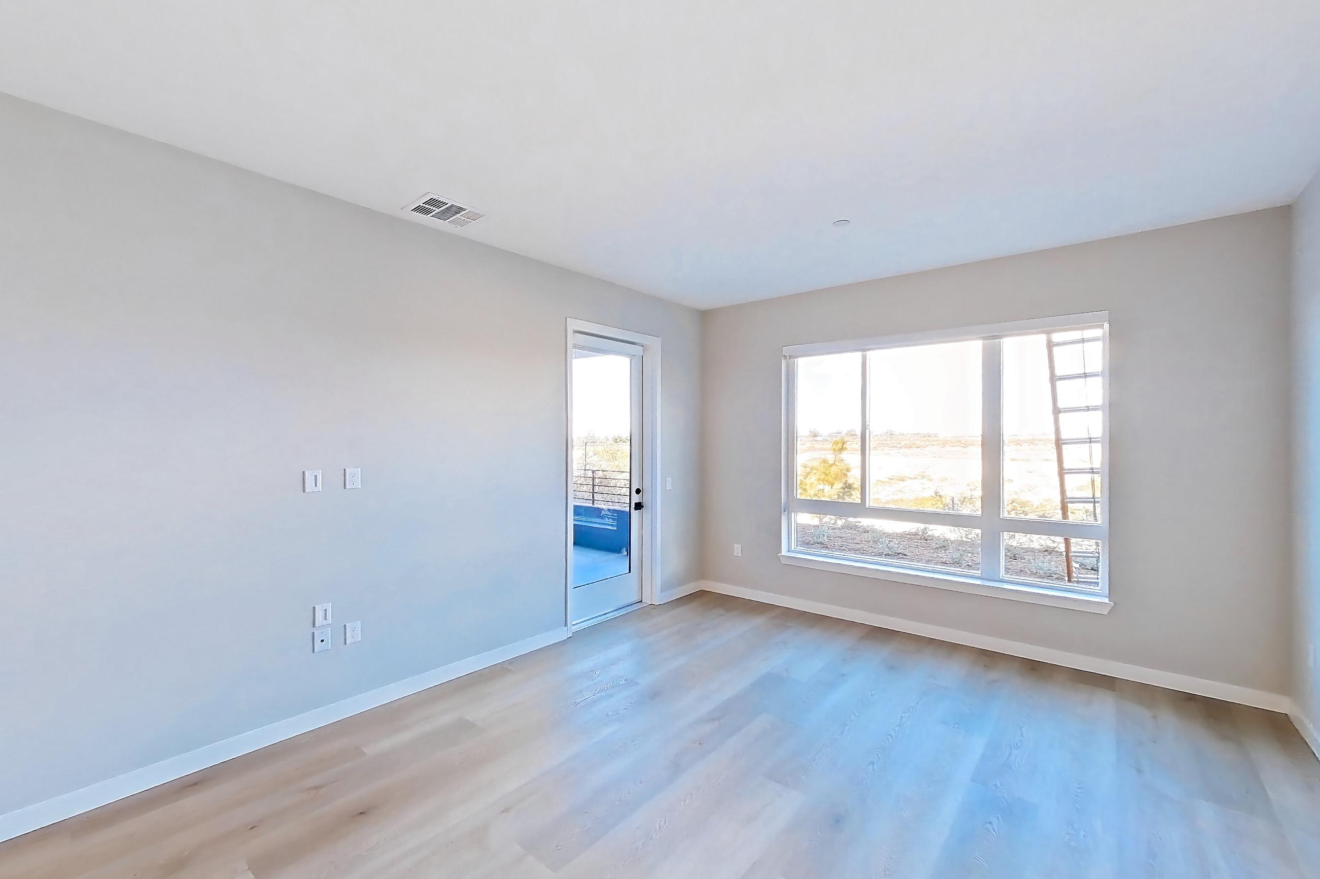 Living room with light wood-finish flooring, Apartment 1105 at VAYA on Axia