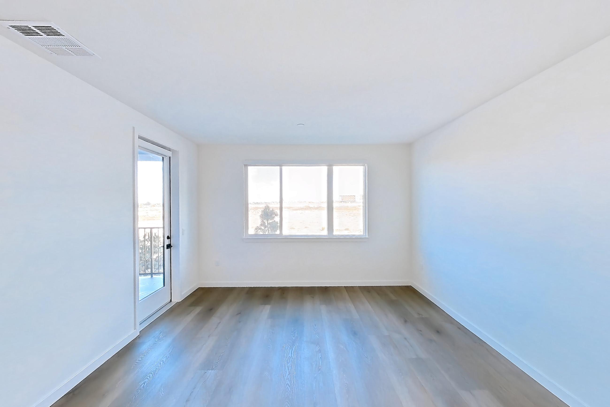 Living room with dark wood-finish flooring and light wood-finish flooring, Apartment 1208 at VAYA on Axia