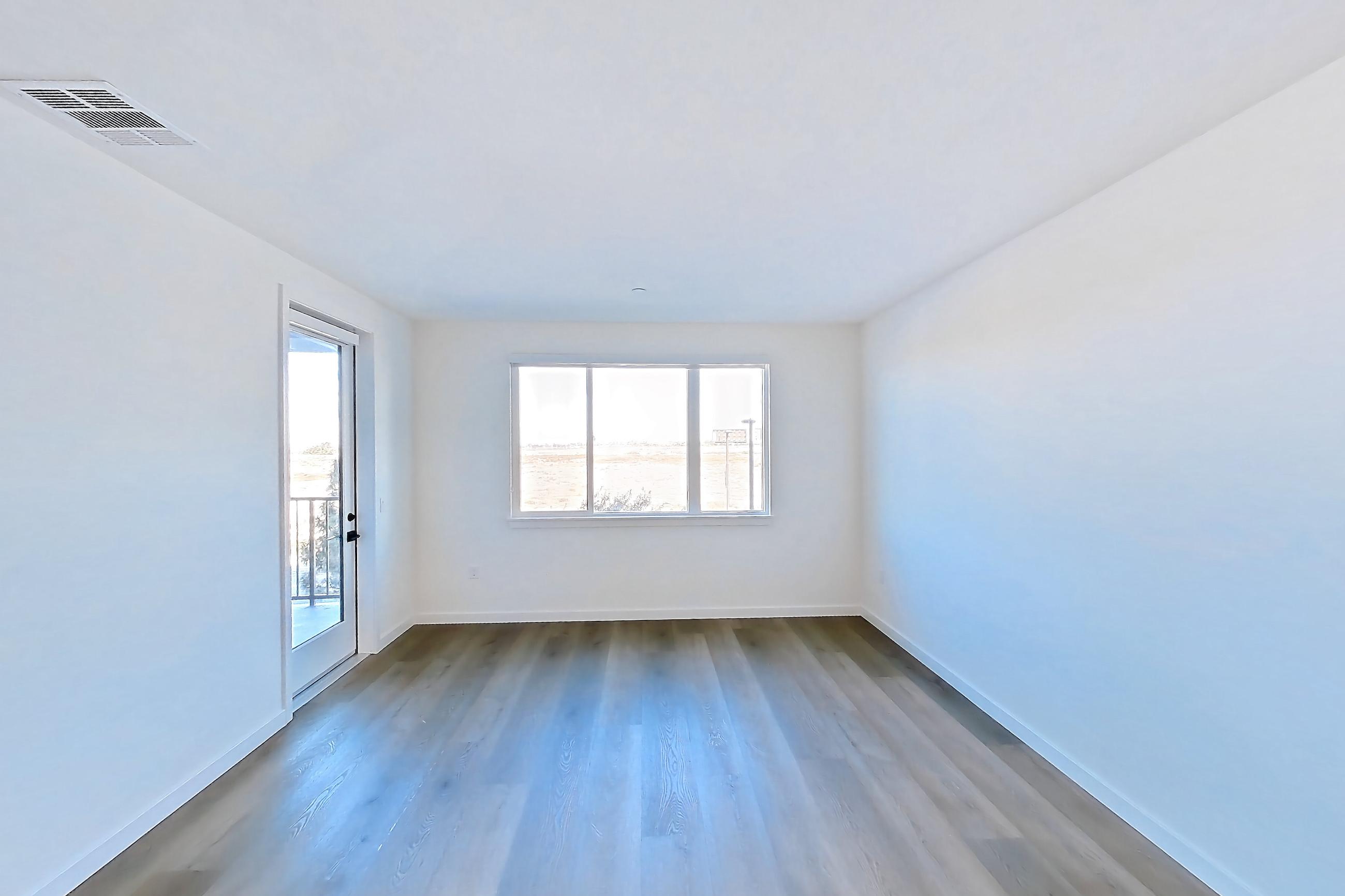 Living room with dark wood-finish flooring, Apartment 1209 at VAYA on Axia