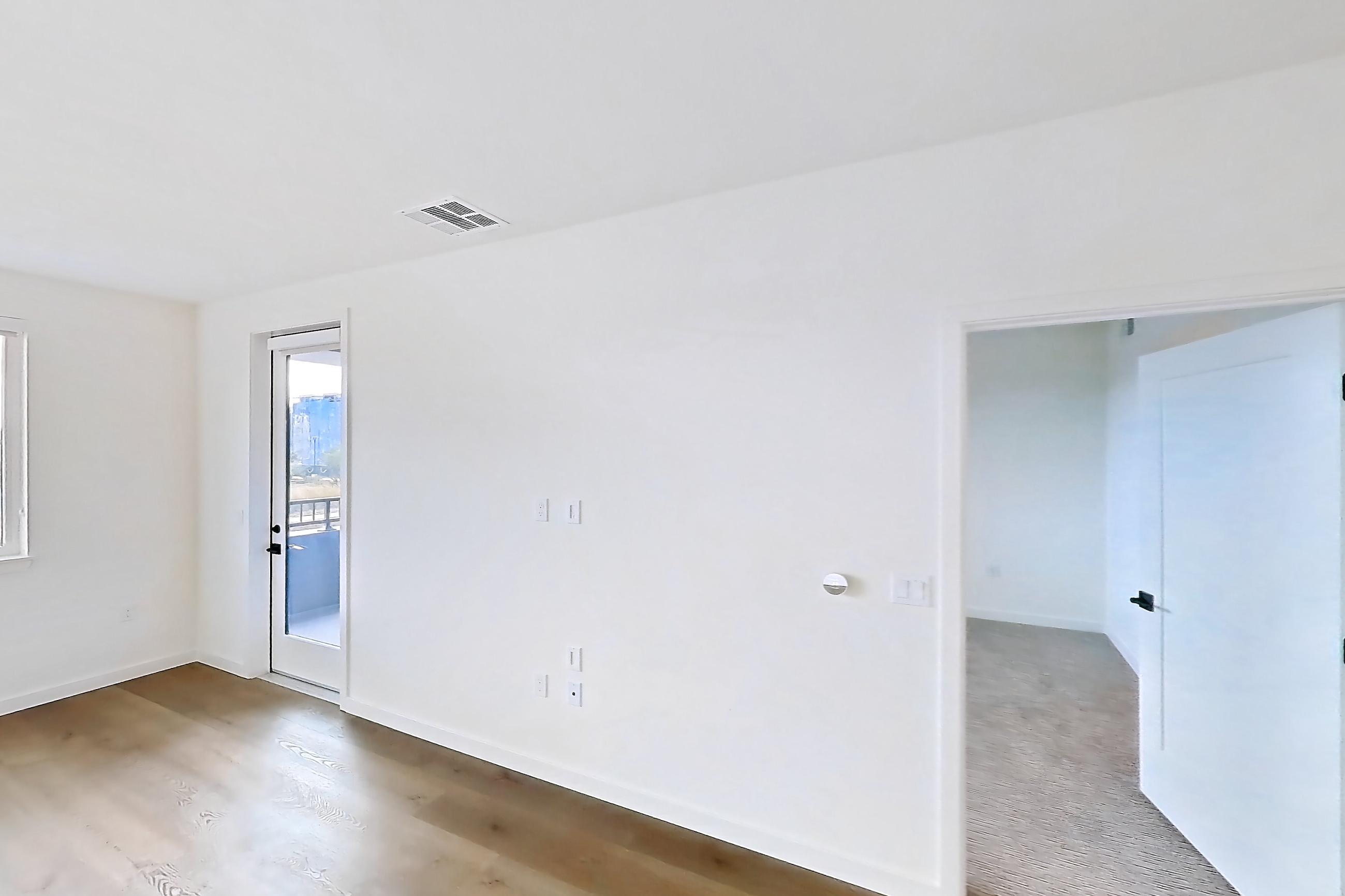Living room with light wood-finish flooring, Apartment 1224 at VAYA on Axia