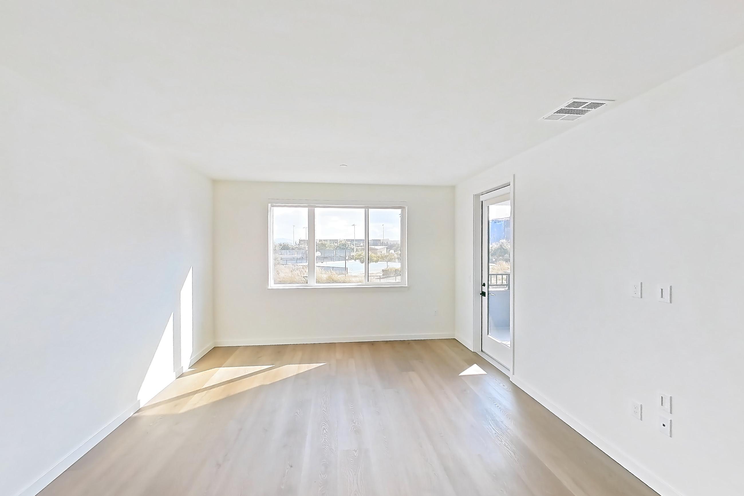Living room with light wood-finish flooring, Apartment 1226 at VAYA on Axia