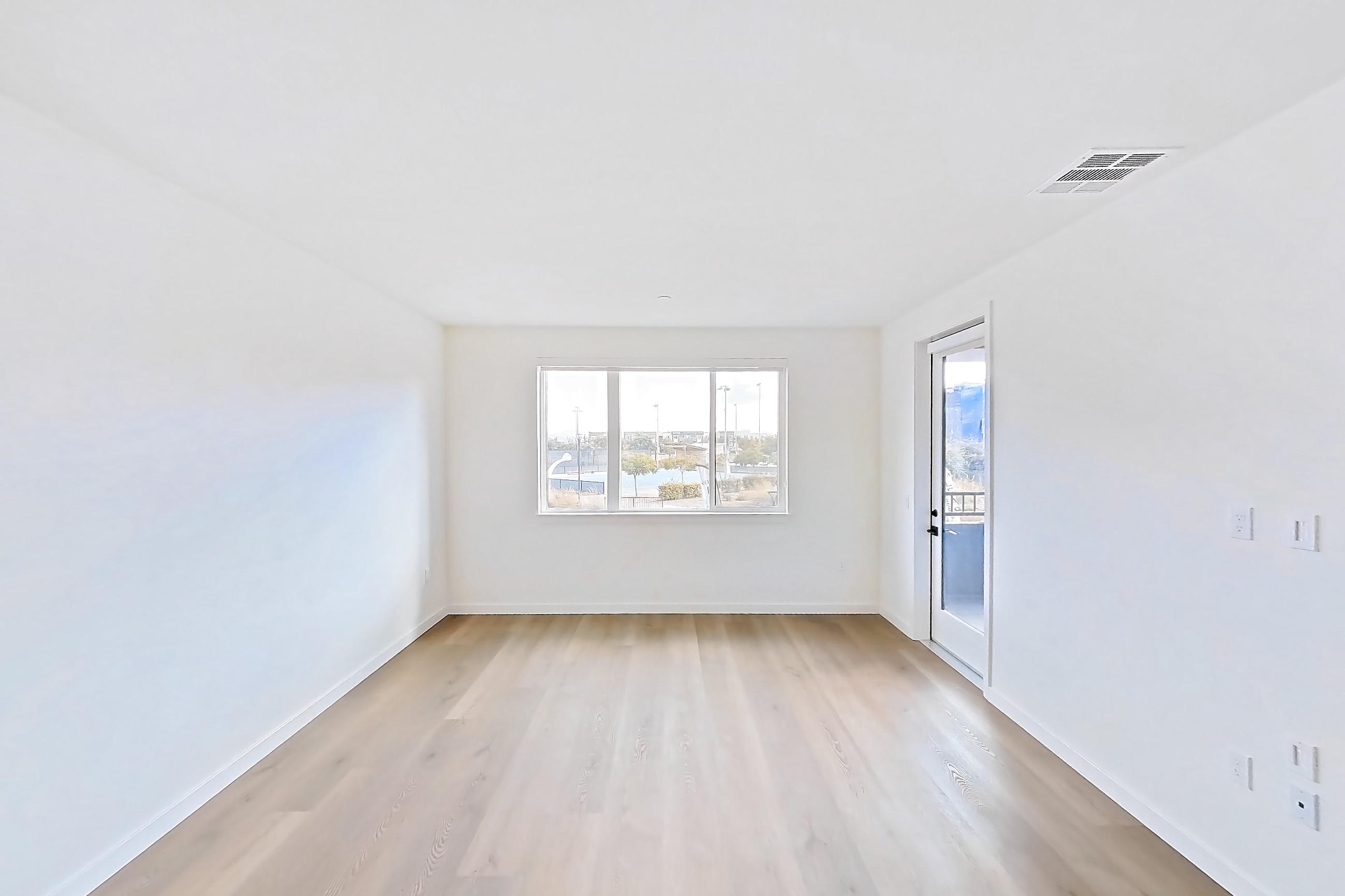 Living room with light wood-finish flooring, Apartment 1228 at VAYA on Axia