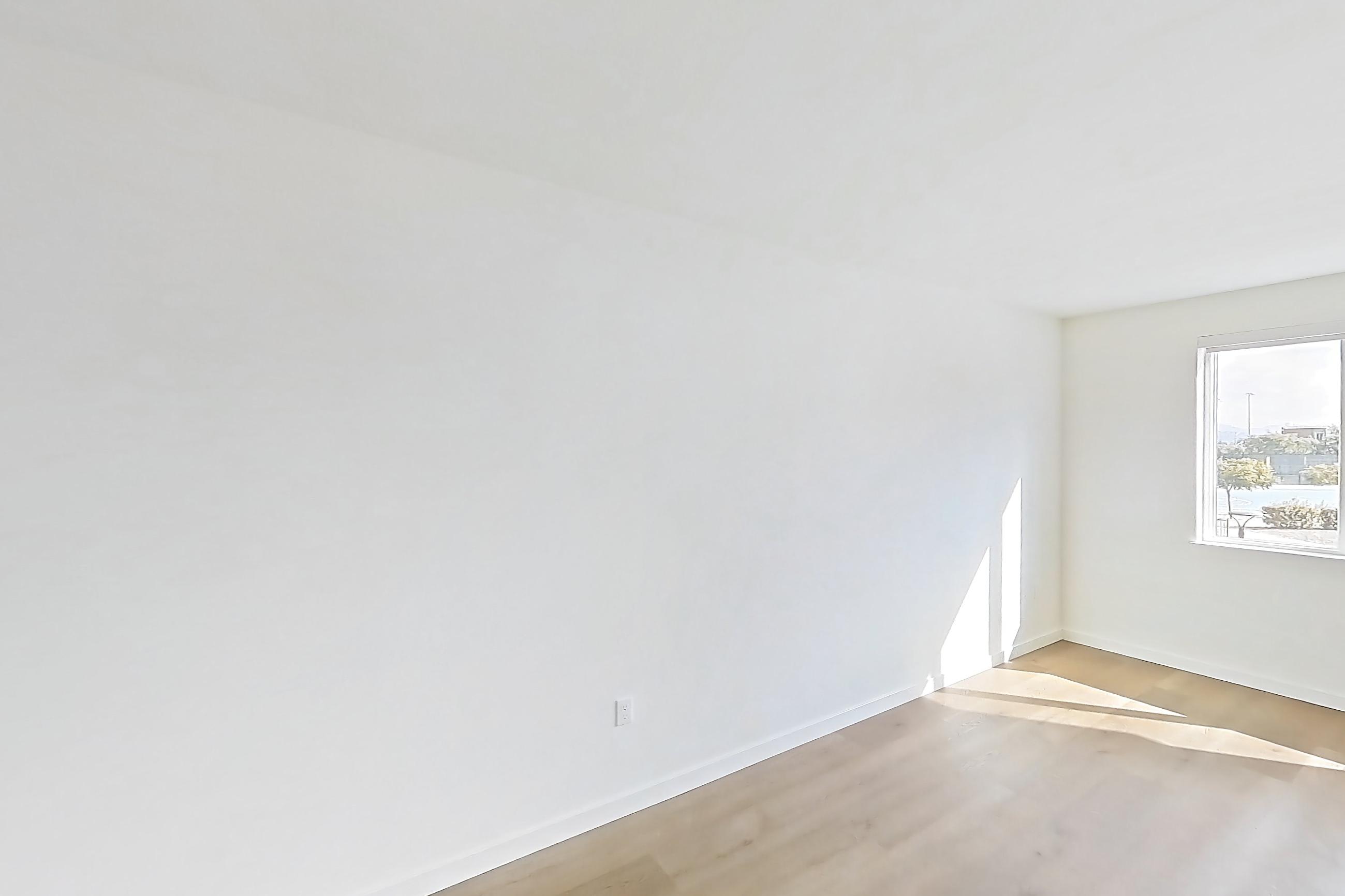 Living room with light wood-finish flooring, Apartment 1230 at VAYA on Axia